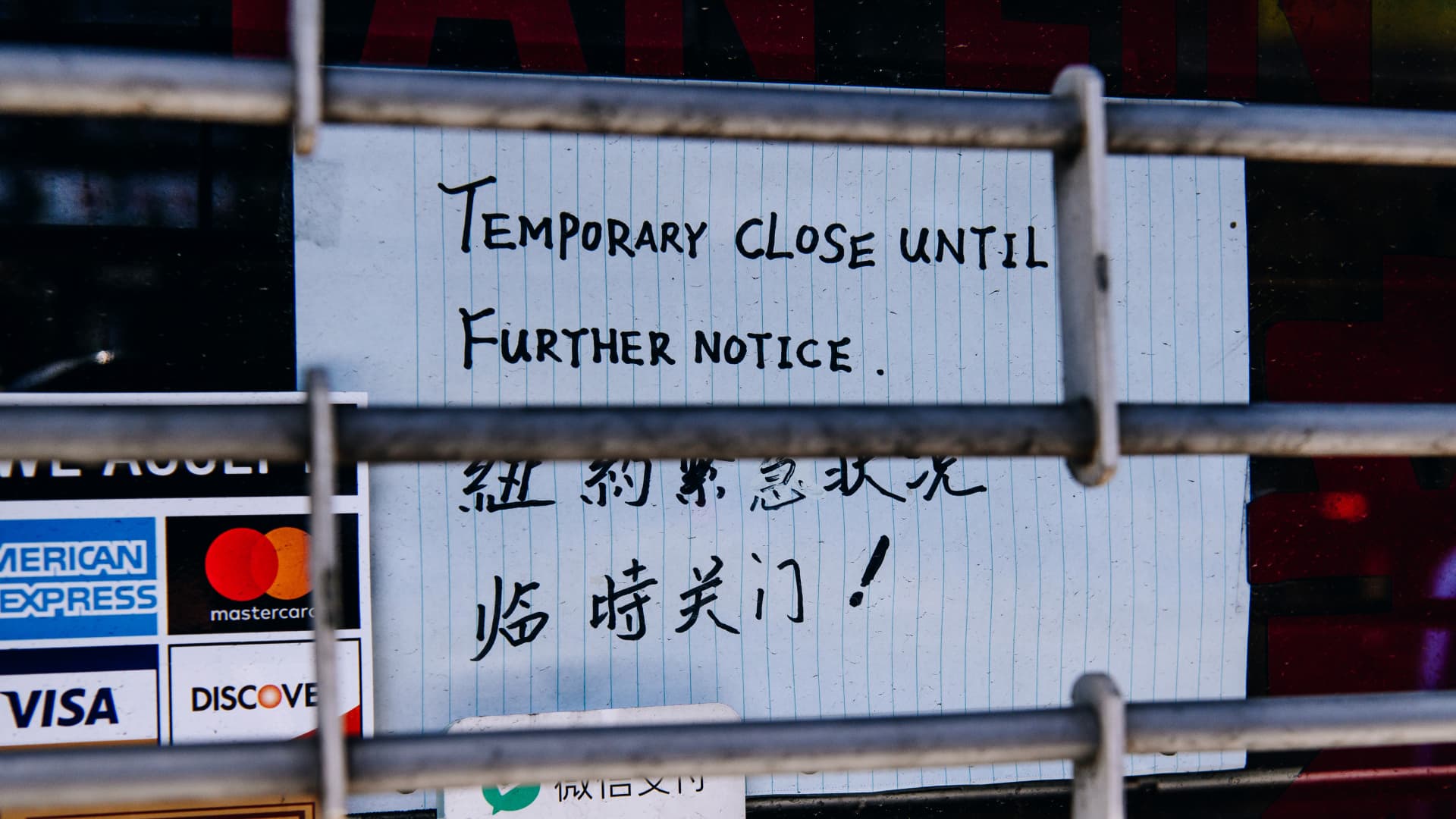 A closed sign is displayed in the window of a business in the Chinatown neighborhood of New York, U.S., on Wednesday, May 27, 2020. Photographer: Nina Westervelt/Bloomberg via Getty Images