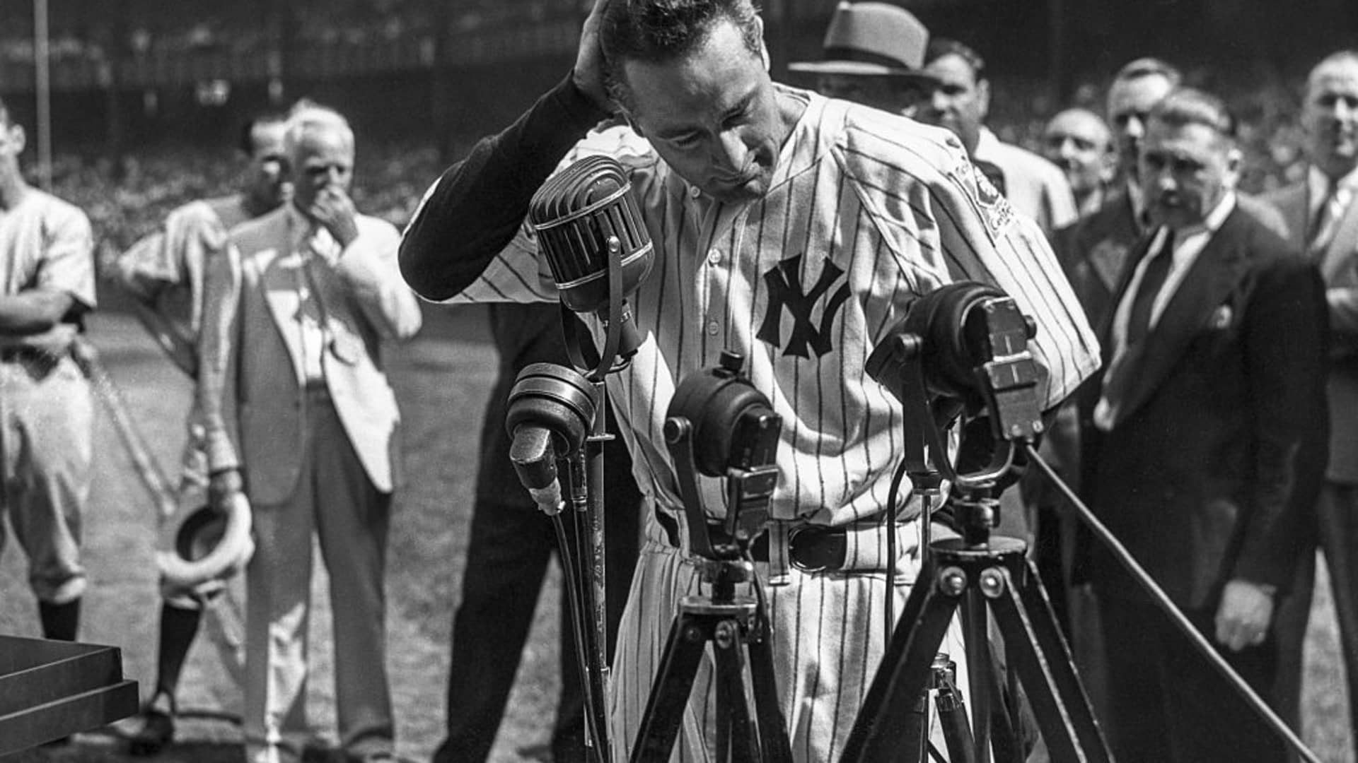 Lou Gehrig #4 of the New York Yankees is shown before the mic delivering his farewell speech on Lou Gehrig Day on July 4, 1939 at Yankee Stadium in the Bronx, New York.