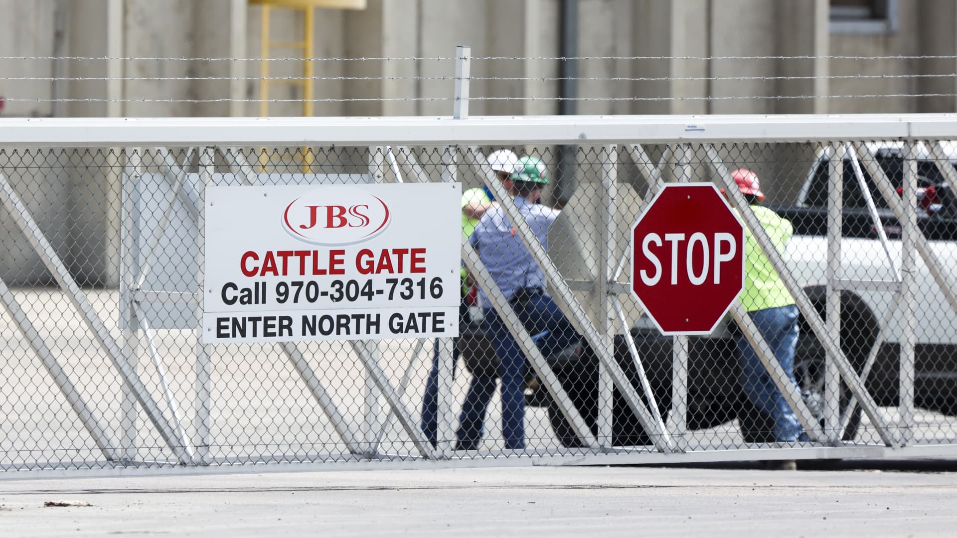 Employees in the parking lot of the JBS Beef Production Facility in Greeley, Colorado, U.S., on Tuesday, June 1, 2021. A cyberattack on JBS SA, the world's largest meat producer, has forced the shutdown of some of the largest slaughterhouses globally, and there are signs that the closures are spreading.