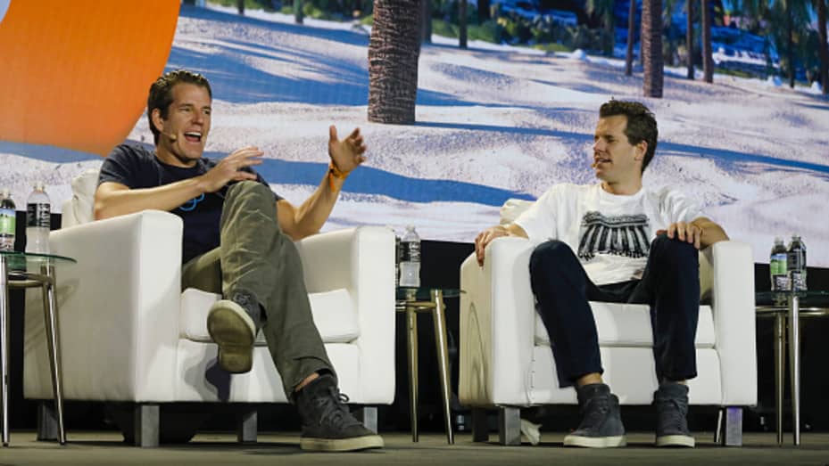 Tyler Winklevoss, chief executive officer and co-founder of Gemini Trust Co., left, and Cameron Winklevoss, president and co-founder of Gemini Trust Co., speak during the Bitcoin 2021 conference in Miami, Florida, U.S., on Friday, June 4, 2021.