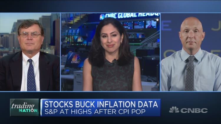 Stocks hit records despite inflation uptick. Trading the disconnect