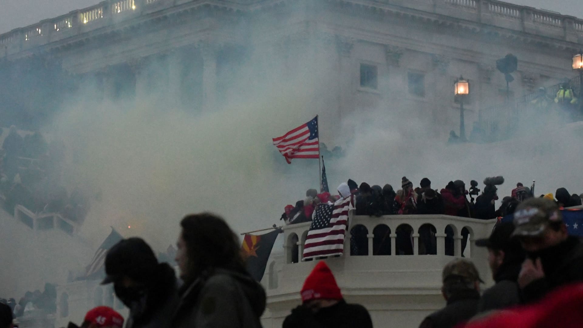Police clear the U.S. Capitol Building with tear gas as supporters of U.S. President Donald Trump gather outside, in Washington, January 6, 2021.