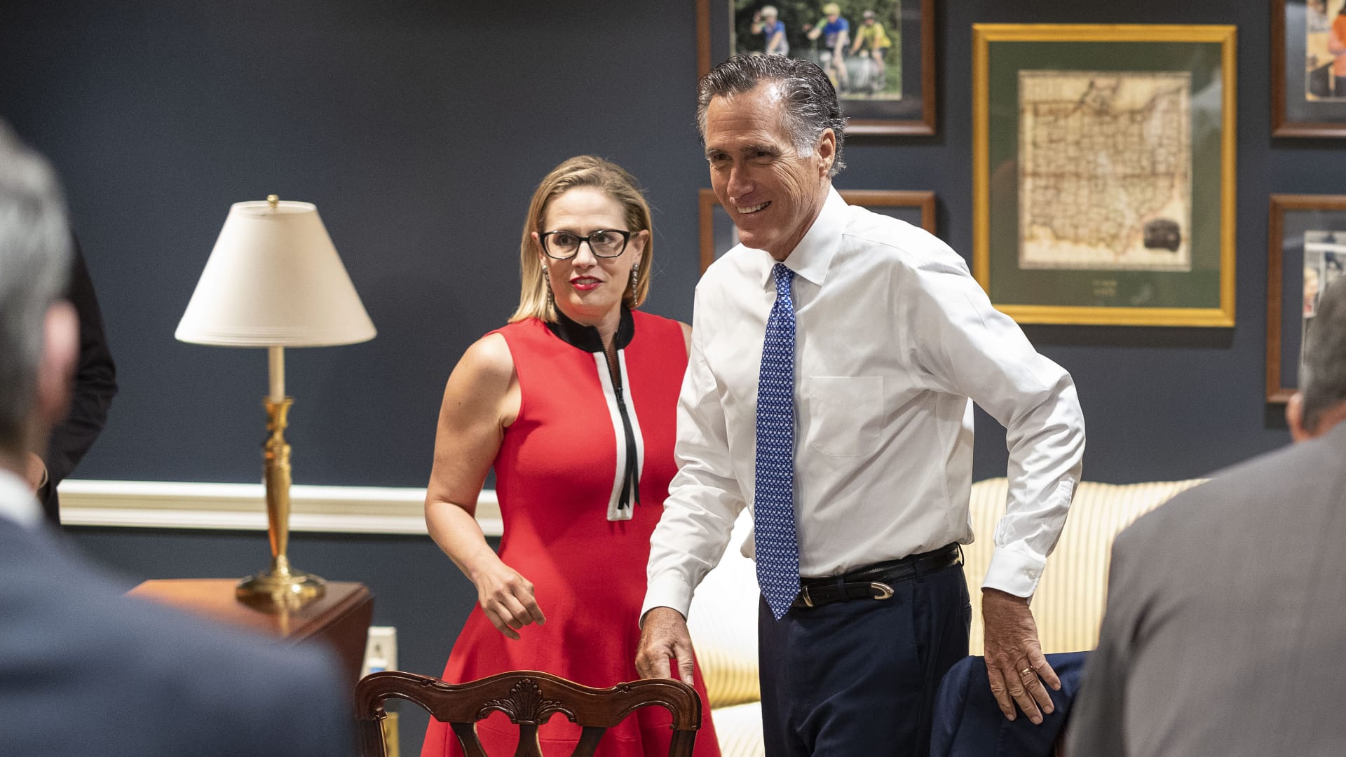 U.S. Sens. Kyrsten Sinema (D-AZ) (L) and Mitt Romney (R-UT) arrive for a bipartisan meeting on infrastructure after original talks fell through with the White House on June 08, 2021 in Washington, DC.