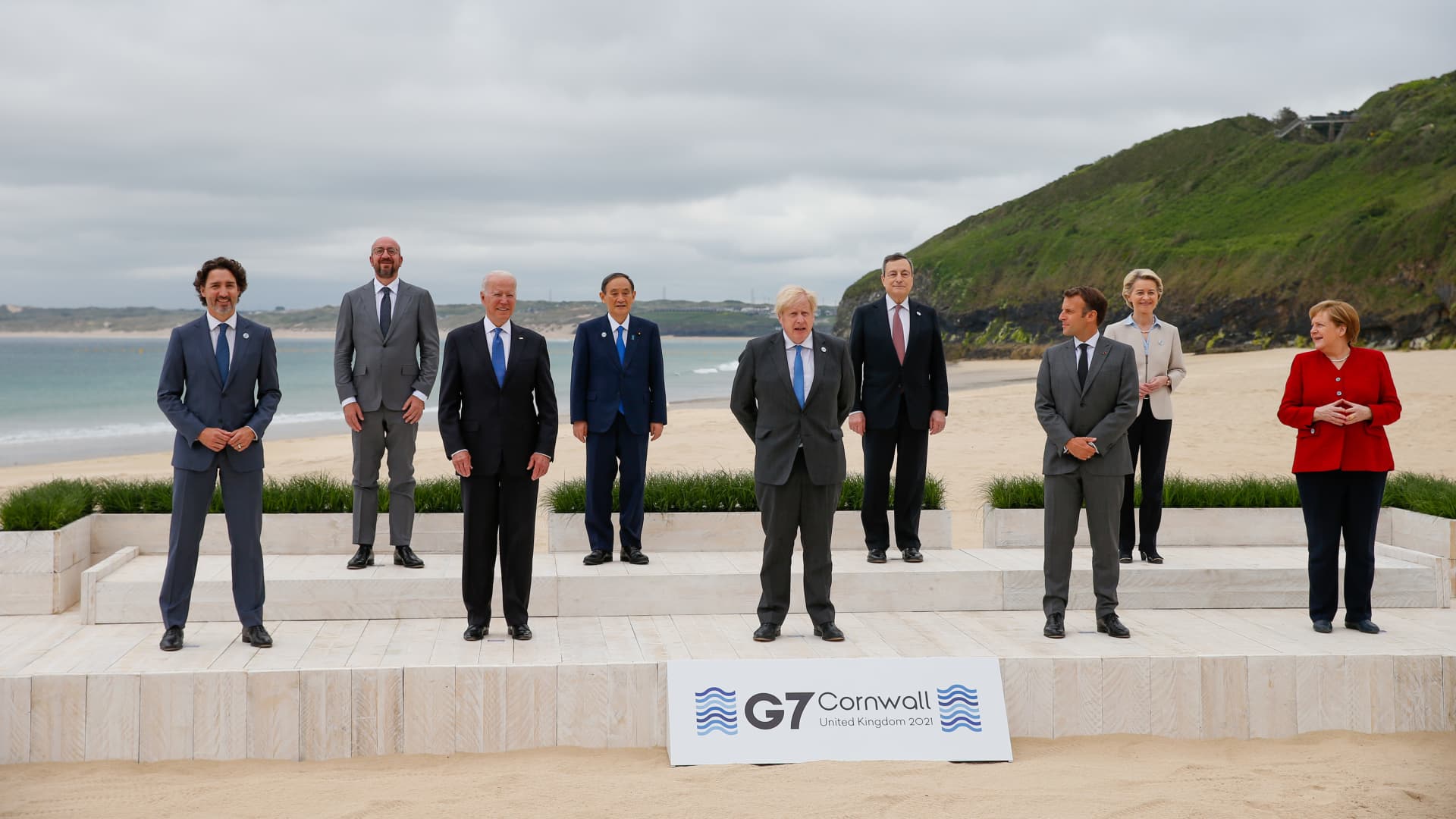 From left to right: Justin Trudeau, Canada's prime minister, Charles Michel, president of the European Council, U.S. President Joe Biden, Yoshihide Suga, Japan's prime minister, Boris Johnson, U.K. prime minister, Mario Draghi, Italy's prime minister, Emmanuel Macron, Frances president, Ursula von der Leyen, president of the European Commission, Angela Merkel, Germanys chancellor, during the family photo on the first day of the Group of Seven leaders summit in Carbis Bay, U.K., on Friday, June 11, 2021.