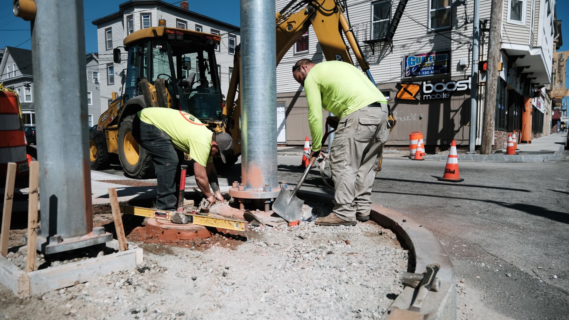 Men work on a construction project on April 09, 2021 in Central Falls, Rhode Island.