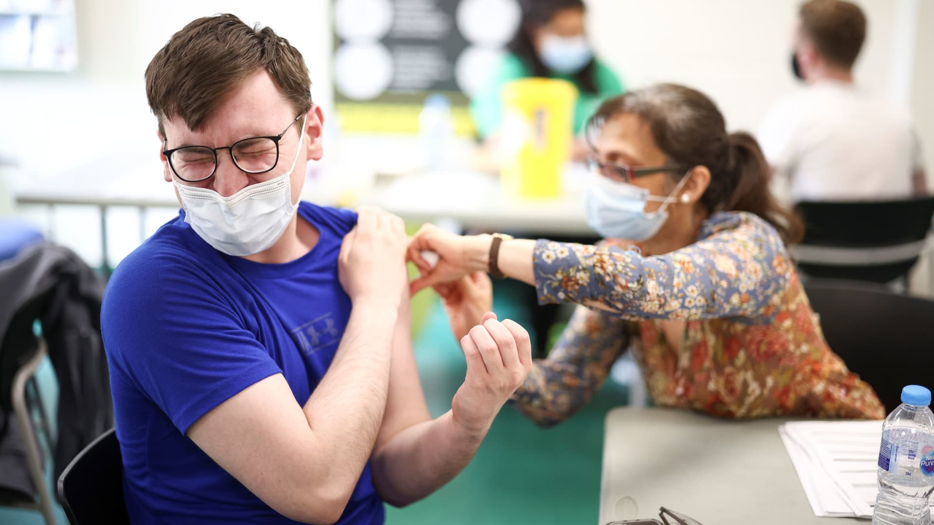 A person receives a dose of the Pfizer BioNTech vaccine at a vaccination centre for those aged over 18 years old at the Belmont Health Centre in Harrow, amid the coronavirus disease (COVID-19) outbreak in London, Britain, June 6, 2021.
