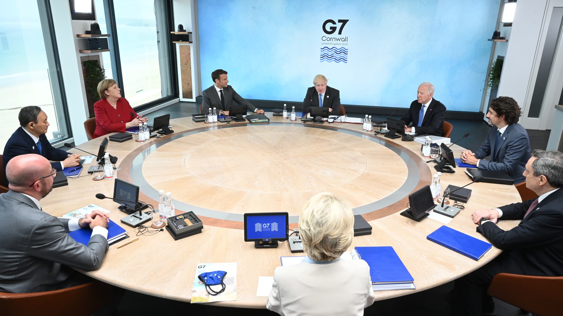 (Clockwise from Top C) British Prime Minister Boris Johnson, U.S. President Joe Biden, Canadian Prime Minister Justin Trudeau, Italian Prime Minister Mario Draghi, President of the European Commission Ursula von der Leyen, President of the European Council Charles Michel, Japanese Prime Minister Yoshihide Suga, German Chancellor Angela Merkel and French President Emmanuel Macron, sit around the table at the top of the G7 meeting in Carbis Bay, on June 11, 2021 in Carbis Bay, Cornwall.