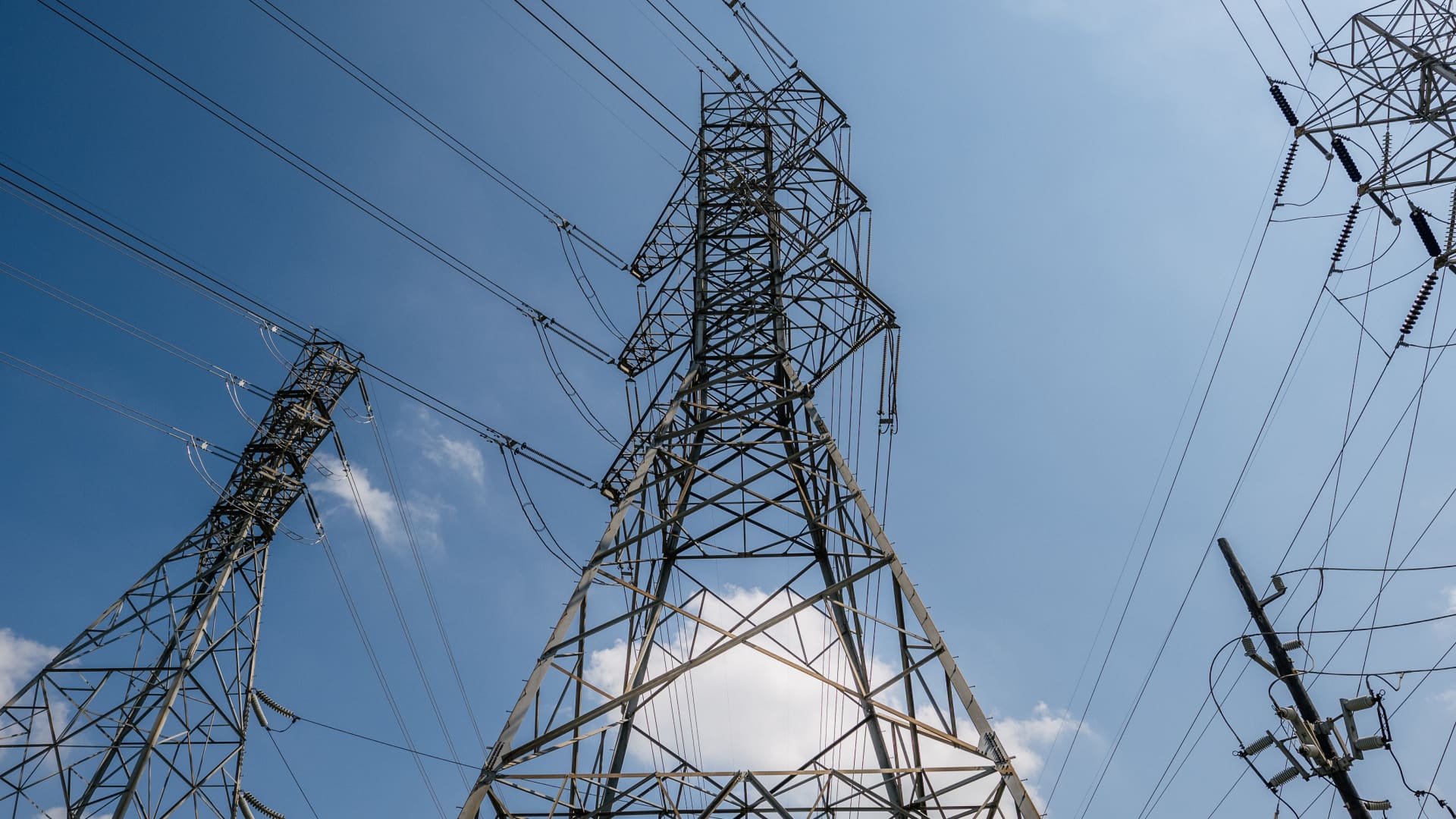 Transmission towers are shown on June 15, 2021 in Houston, Texas. The Electric Reliability Council of Texas (ERCOT), which controls approximately 90% of the power in Texas, has requested Texas residents to conserve power through Friday as temperatures surge in the state.