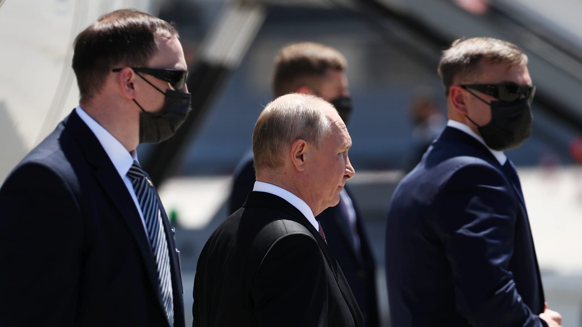 Russia's President Vladimir Putin (C) welcomed at Geneva Airport as he arrives for a Russia-United States summit.