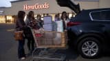 Shoppers load up their vehicle outside a HomeGoods store in South Bend, Indiana, on Monday, Nov. 16, 2020.