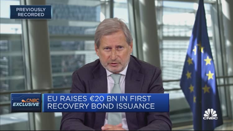 Banks excluded from issuance over historical collusion: EU's Hahn