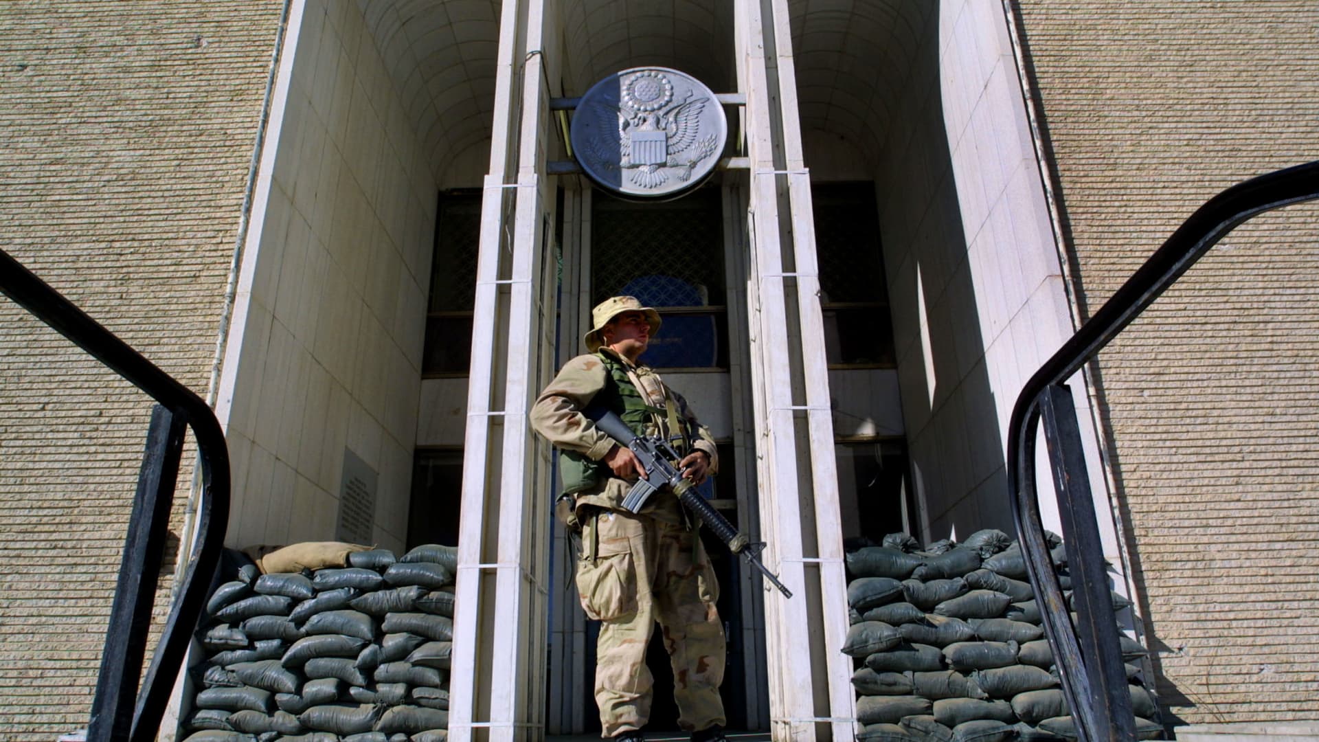 A US Marine stands guard in front of the US embassy December 21, 2001 in Kabul, Afghanistan.