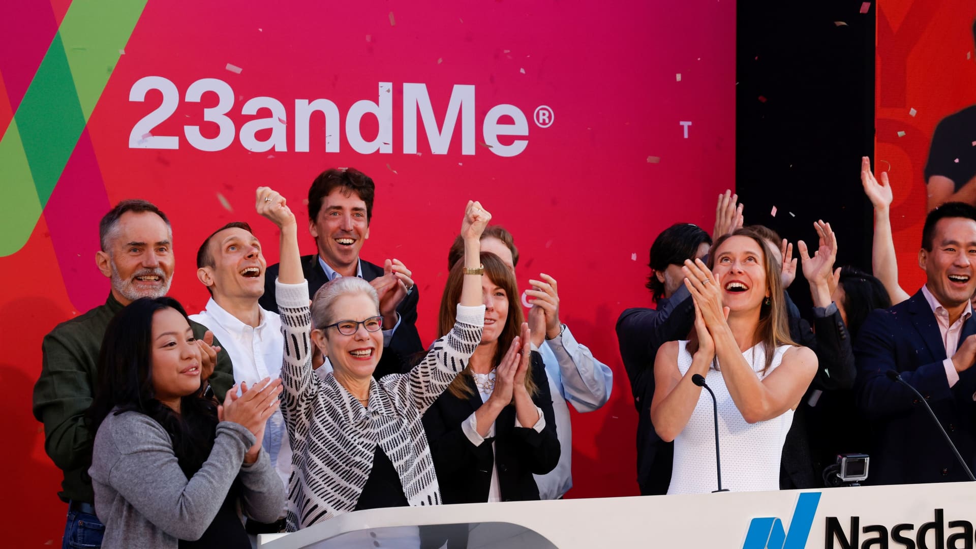 Anne Wojcicki, 23andMe co-founder & CEO (right) celebrates with 23andMe employees after remotely ringing the NASDAQ opening bell at the headquarters of DNA tech company 23andMe in Sunnyvale, California, U.S., June 17, 2021.