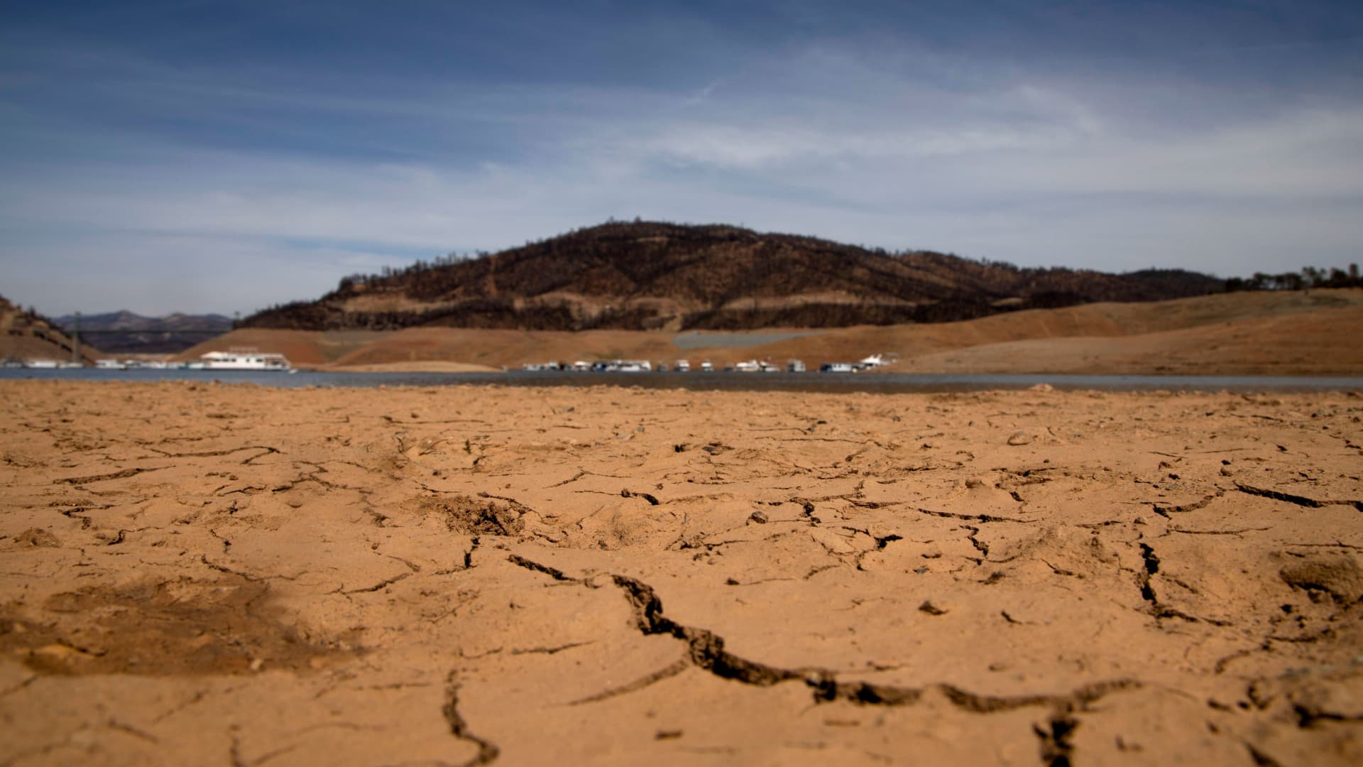 Dry land is visible, at a section that is normally under water, on the banks of Lake Oroville, which is the second largest reservoir in California and according to daily reports of the state's Department of Water Resources is near 35% capacity near Oroville, California, June 16, 2021.