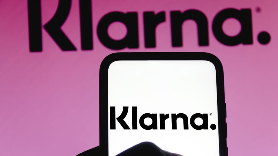 The Klarna logo displayed on a smartphone.
