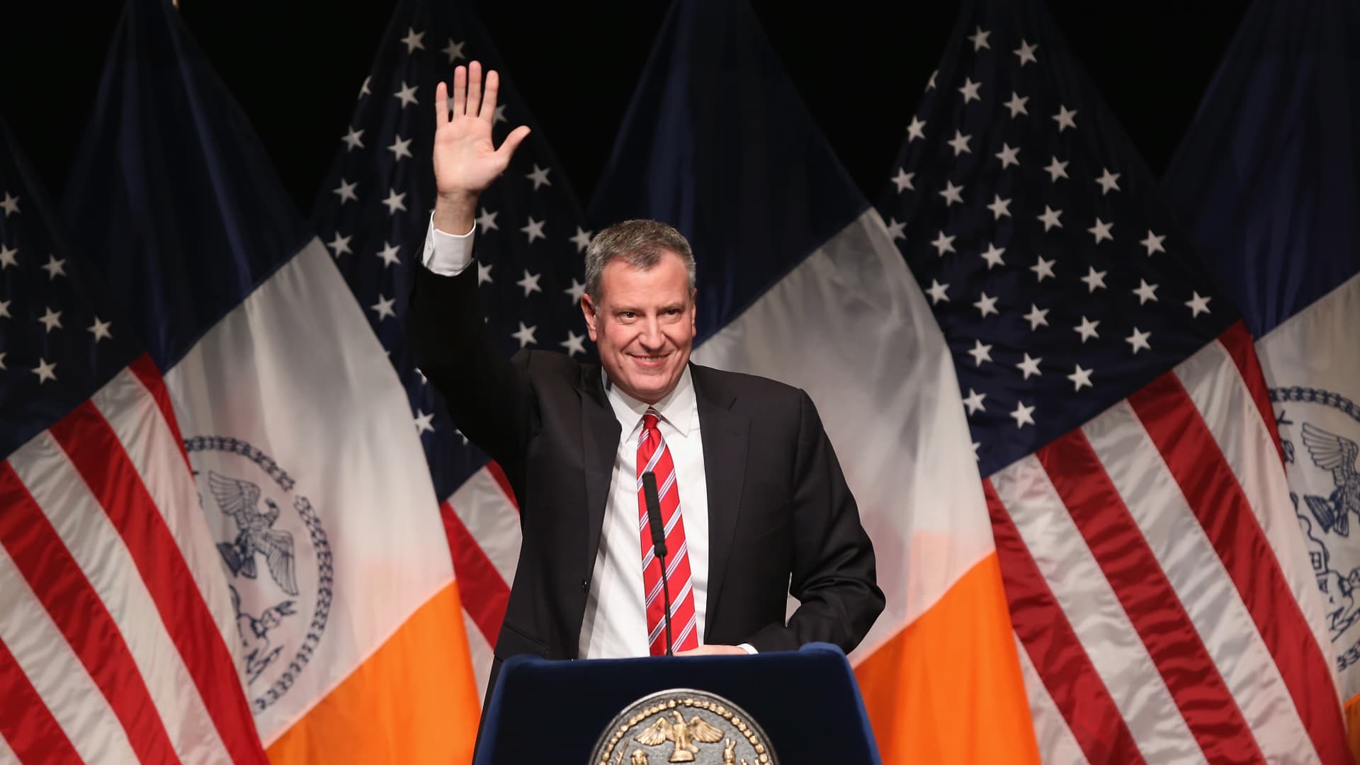 New York City Mayor Bill de Blasio waves as he gives the State of the City address at La Guardia Community College on February 10, 2014 in the Long Island City section of the Queens borough of New York City.