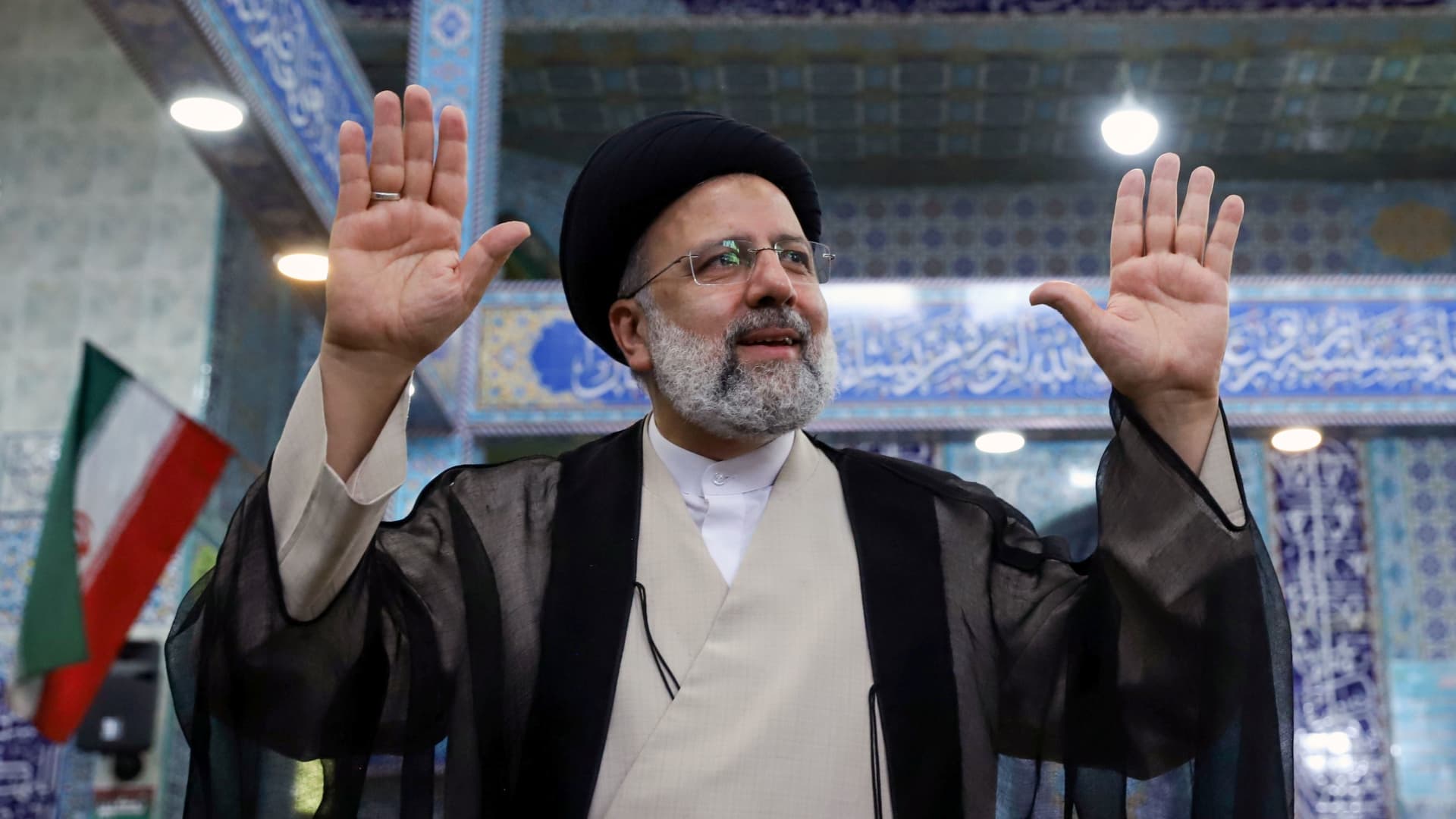 Presidential candidate Ebrahim Raisi gestures after casting his vote during presidential elections at a polling station in Tehran, Iran June 18, 2021.