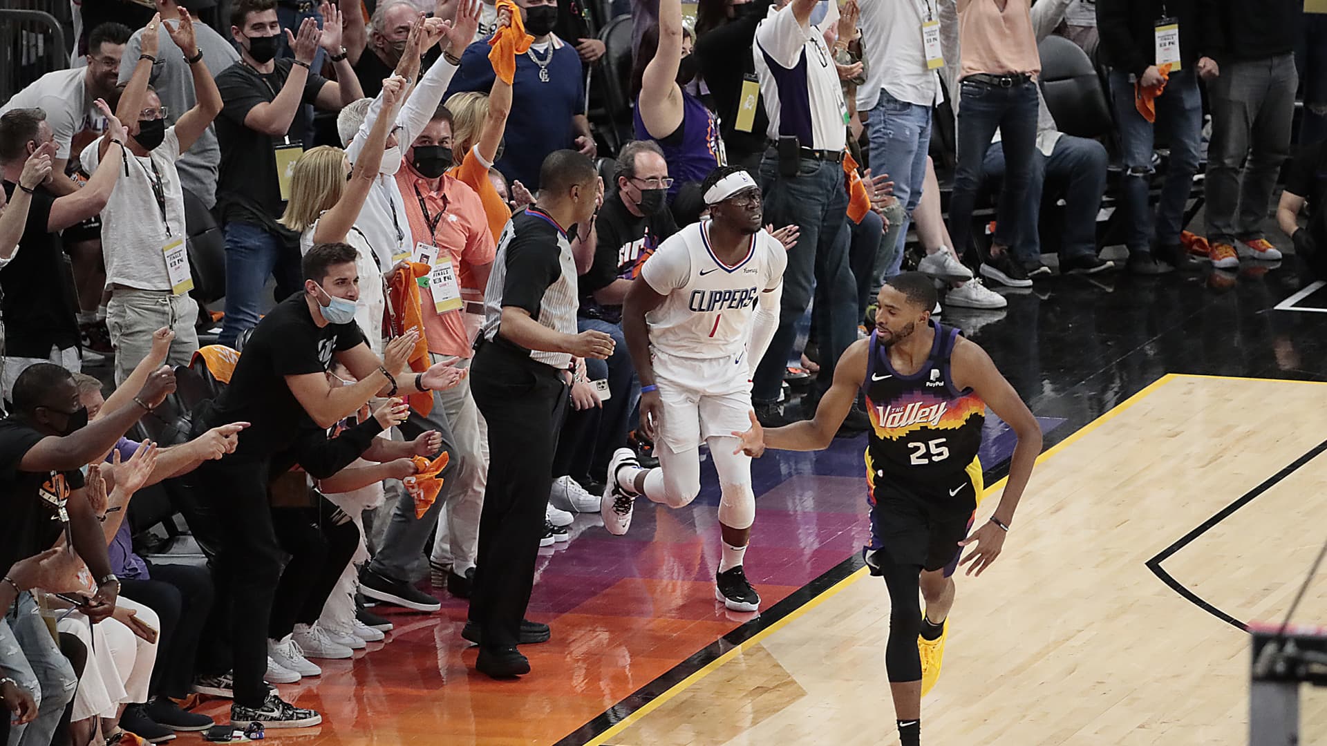 Fans erupt after Phoenix Suns forward Mikal Bridges (25) hit a three-pointer over LA Clippers guard Reggie Jackson (1) late in Game one of the NBA Western Conference Finals at Phoenix Suns Arena.
