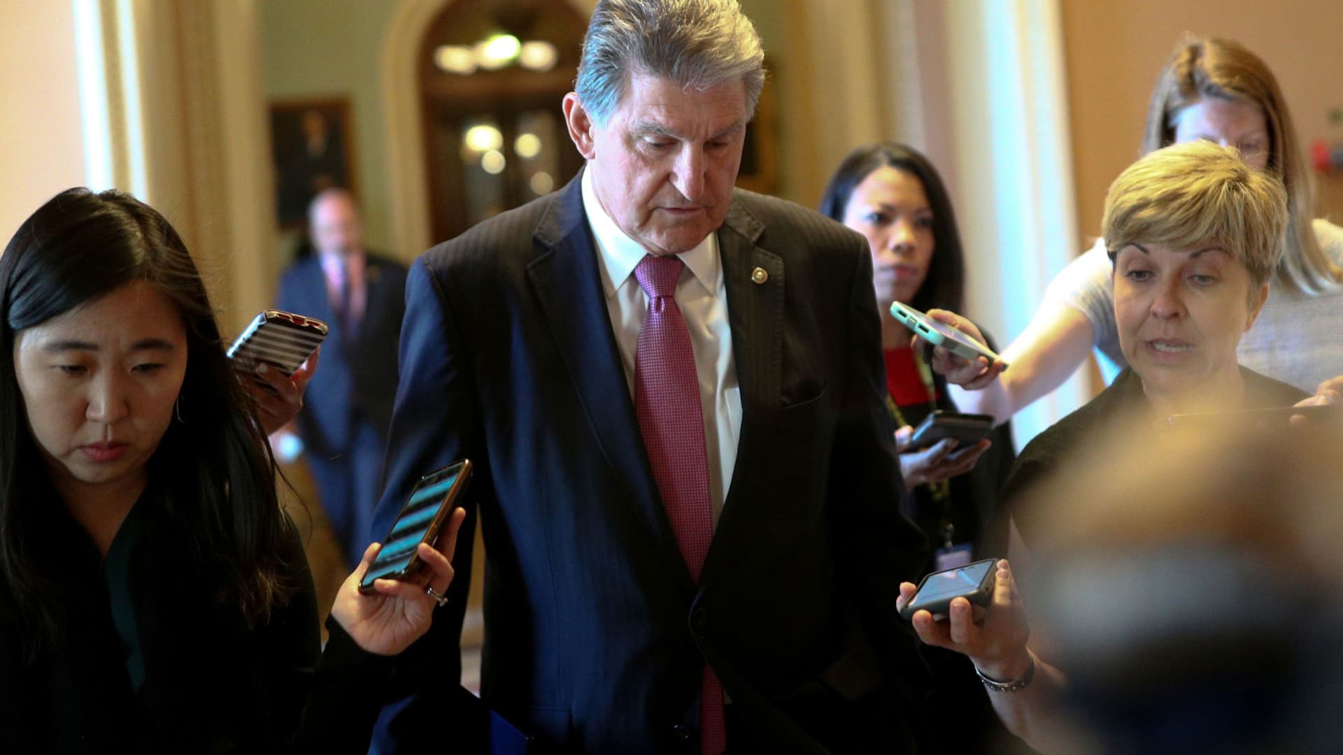 Senator Joe Manchin (D-WV) speaks to news reporters before attending a meeting on infrastructure on Capitol Hill in Washington, June 23, 2021.