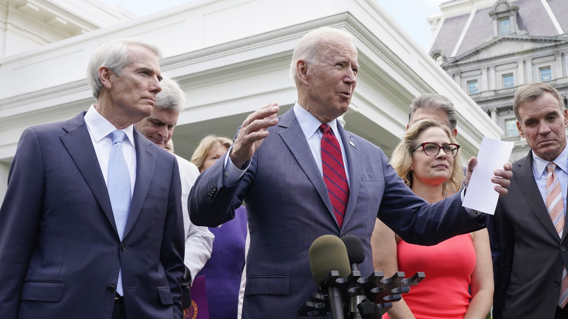 President Joe Biden, with a bipartisan group of senators, speaks Thursday June 24, 2021, outside the White House in Washington. Biden invited members of the group of 21 Republican and Democratic senators to discuss the infrastructure plan.