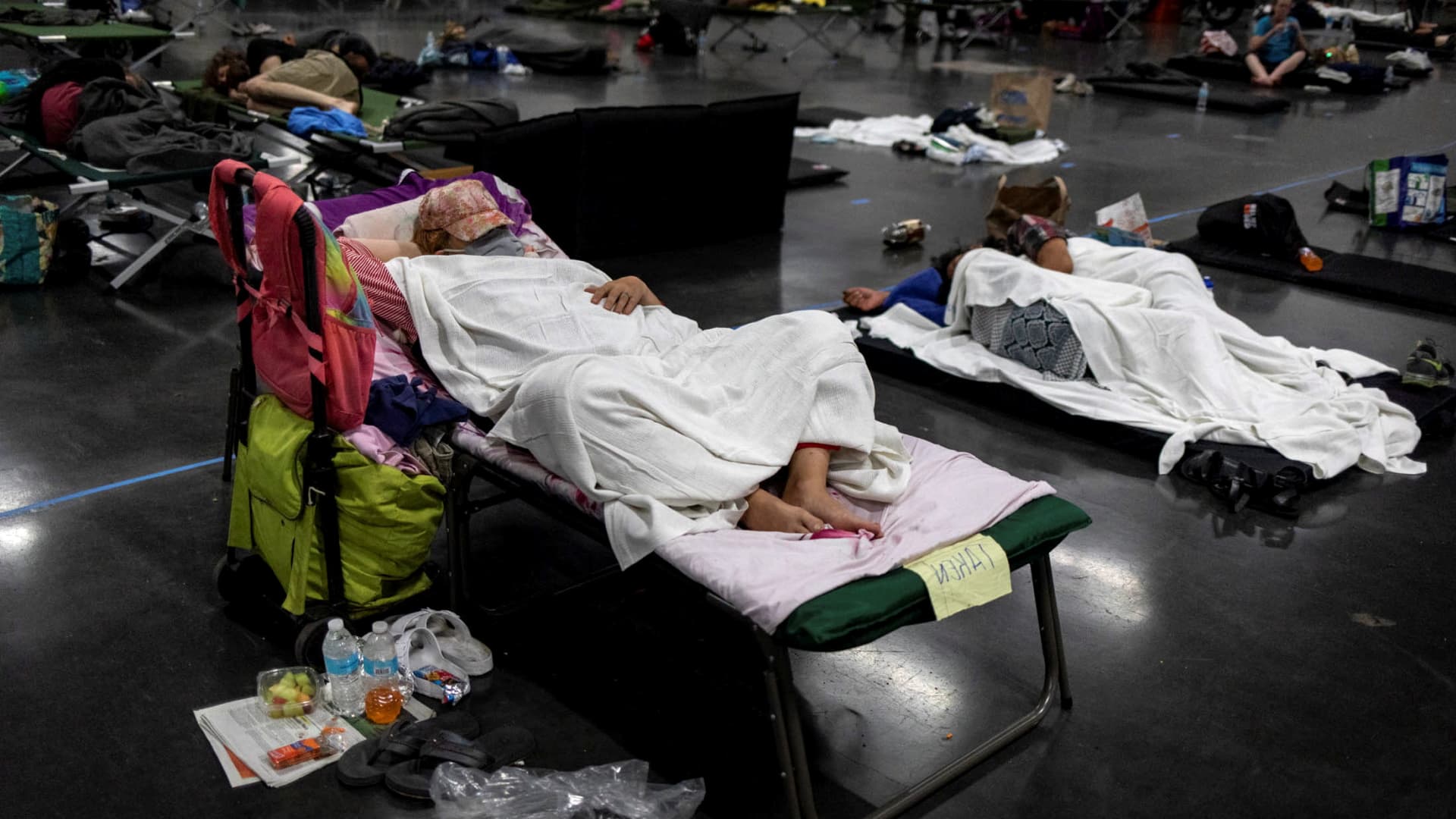 People sleep at a cooling shelter set up during an unprecedented heat wave in Portland, Oregon, U.S. June 27, 2021.