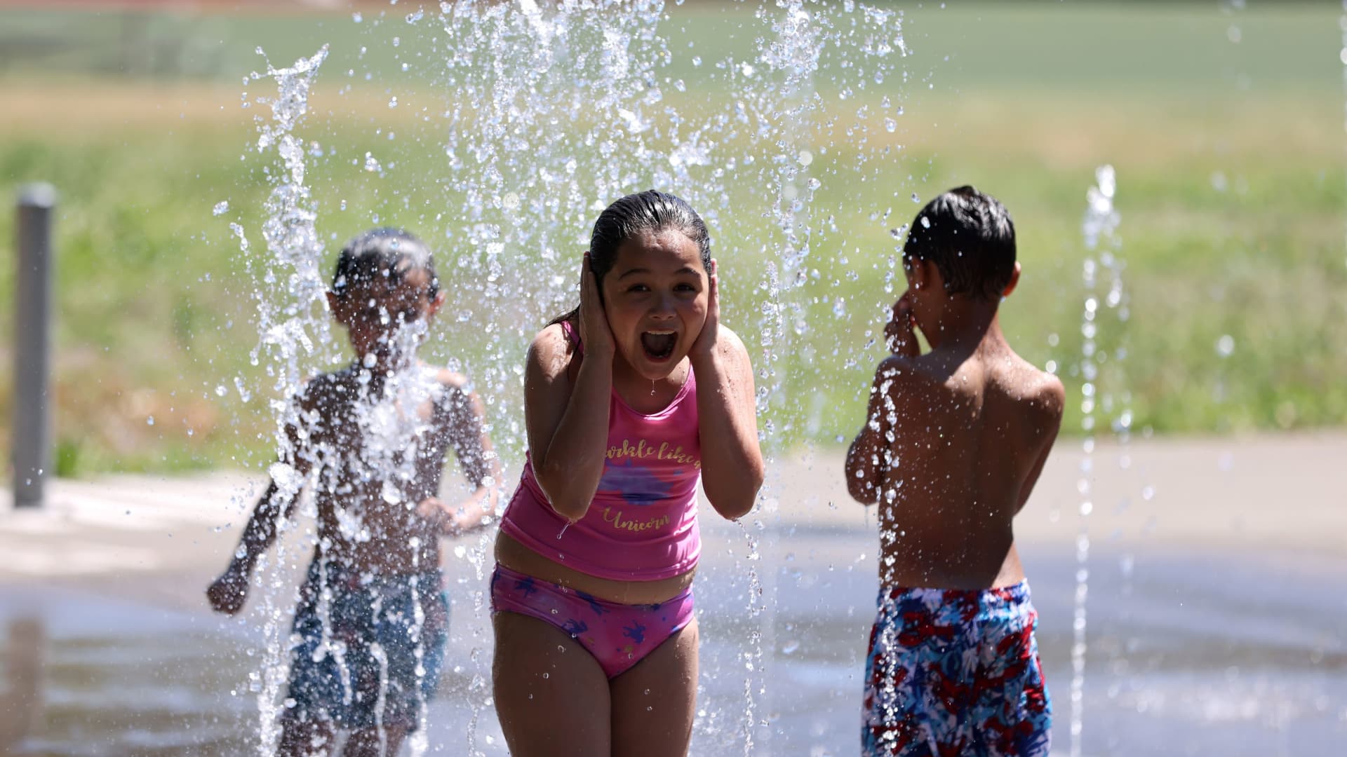 Isis Givens-Guttierrez, 9, cools off in Georgetown Playfield splash park during a heat wave in Seattle, Washington, U.S., June 26, 2021.