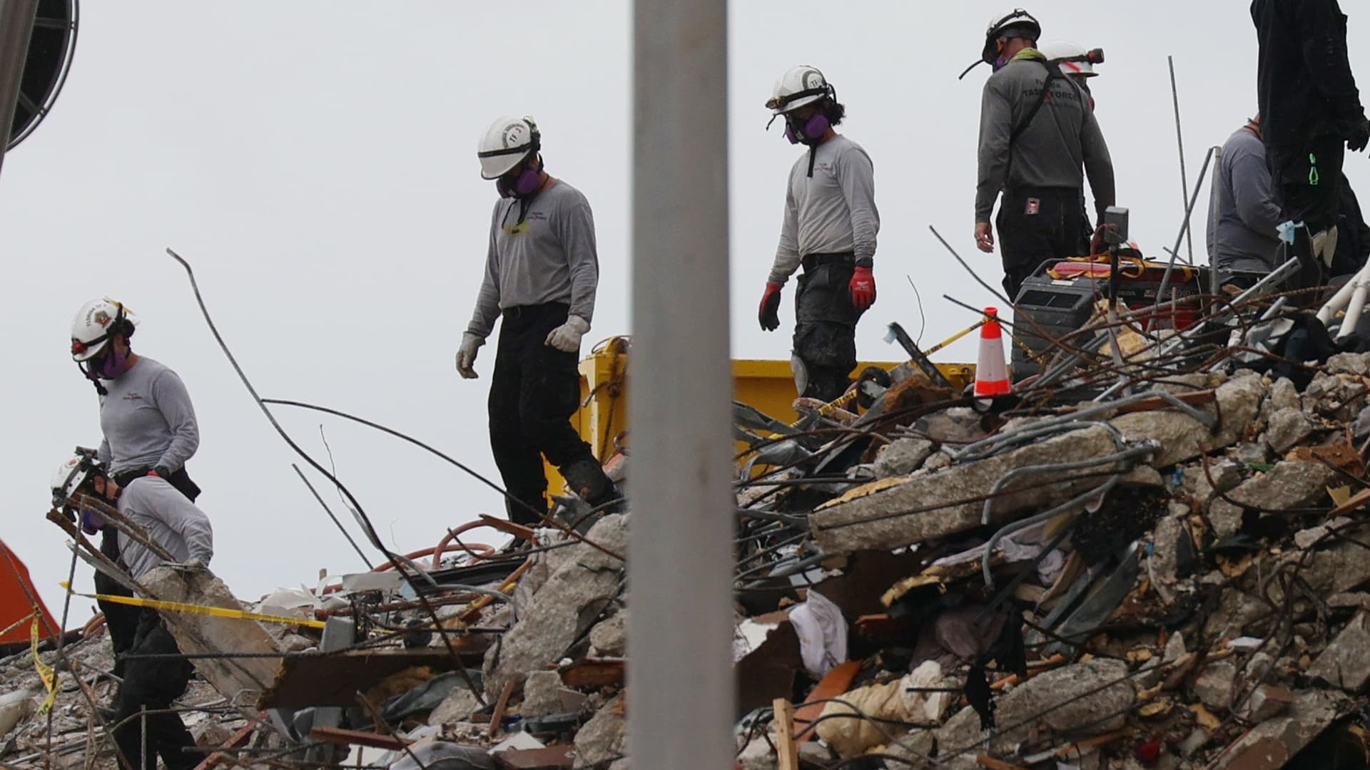 Search and Rescue teams look for possible survivors and to recover remains in the partially collapsed 12-story Champlain Towers South condo building on June 30, 2021 in Surfside, Florida.