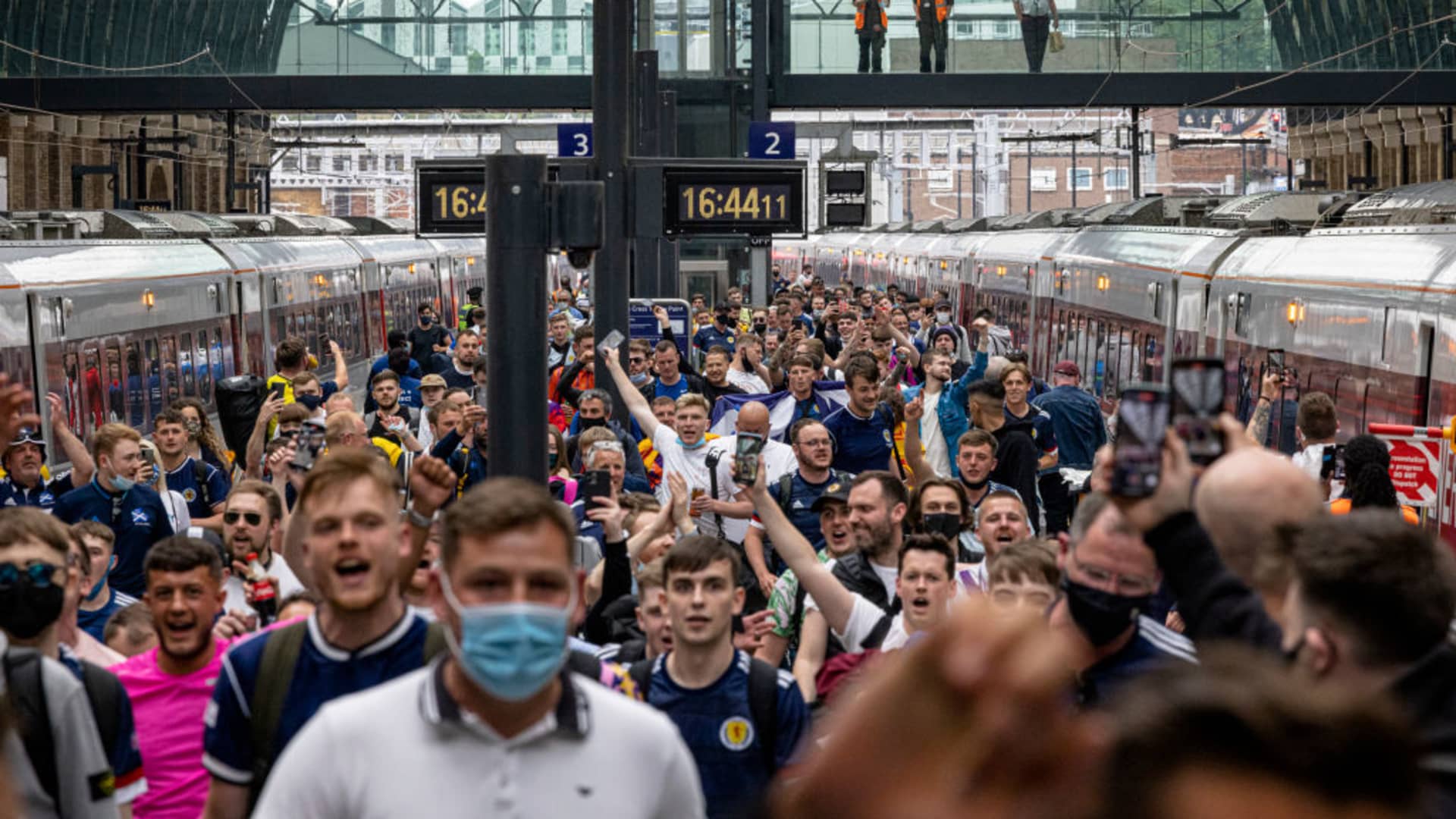 Scotland fans arrive at King's Cross Station on June 17, 2021 in London, England. Soccer games, taking place during the Euros, have been blamed for a rise in Covid cases numbers.