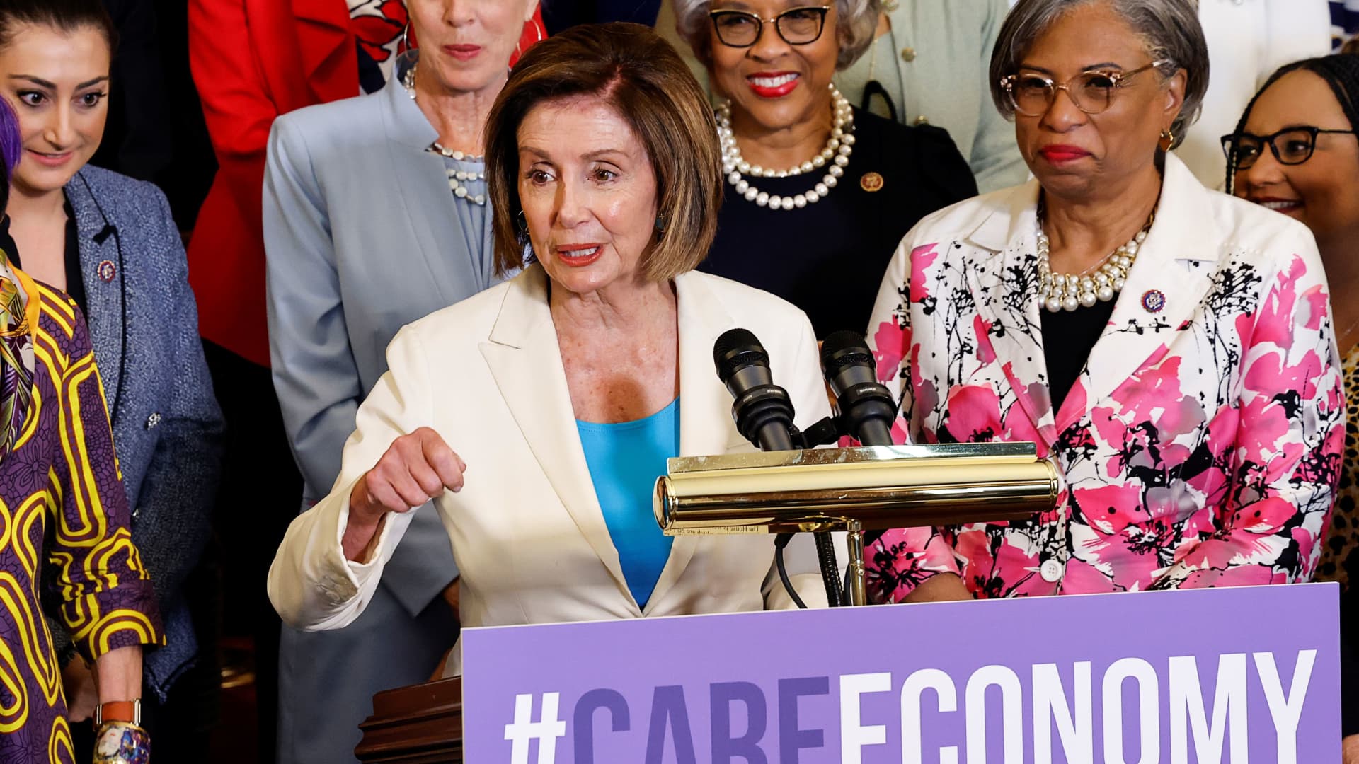 U.S. House Speaker Nancy Pelosi (D-CA) stands with members of the Democratic Women's Caucus (DWC) during a press event on the care economy at the U.S. Capitol in Washington, July 1, 2021.