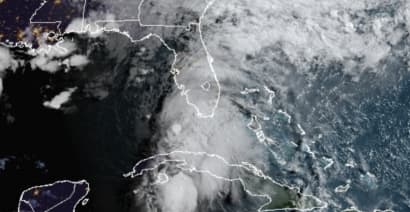 Officials: Storm lashing Florida strengthens into hurricane