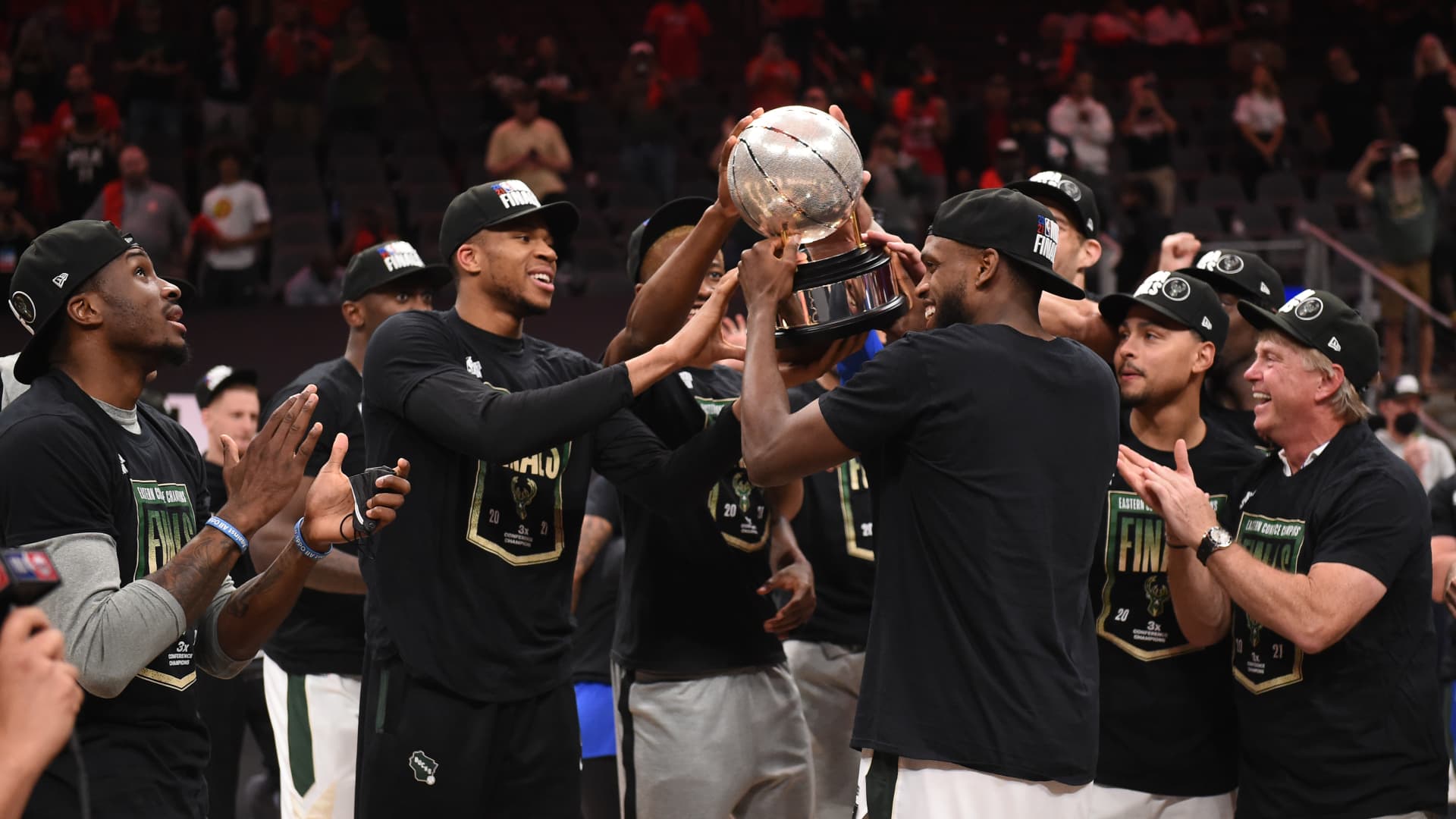 Khris Middleton #22 of the Milwaukee Bucks holds up the Eastern Conference Finals Trophy after the game against the Atlanta Hawks during Game 6 of the Eastern Conference Finals of the 2021 NBA Playoffs on July 3, 2021 at State Farm Arena in Atlanta, Georgia.