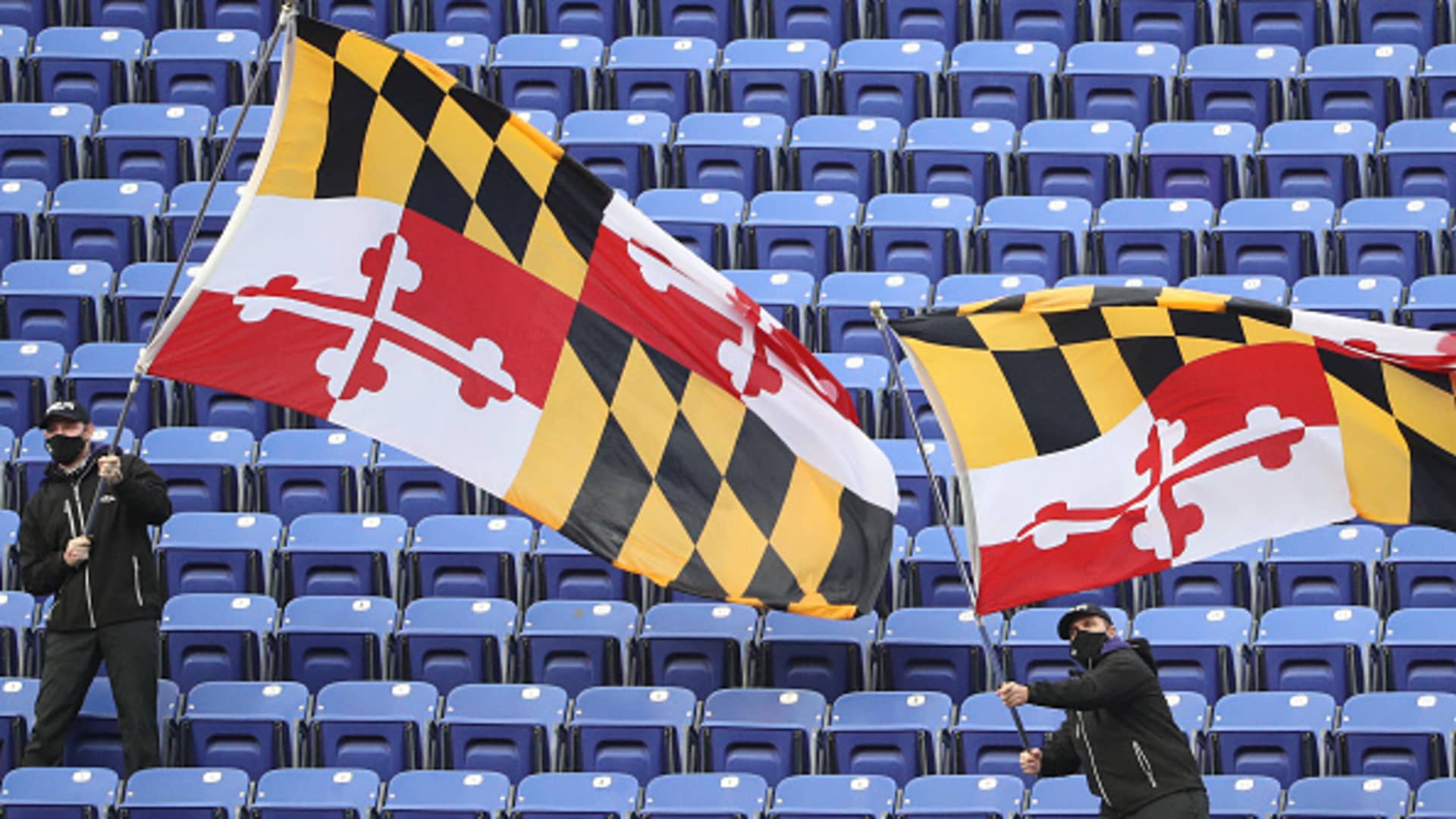 Baltimore Ravens employees wave Maryland flags in the stands at M&T Bank Stadium on November 01, 2020 in Baltimore, Maryland.