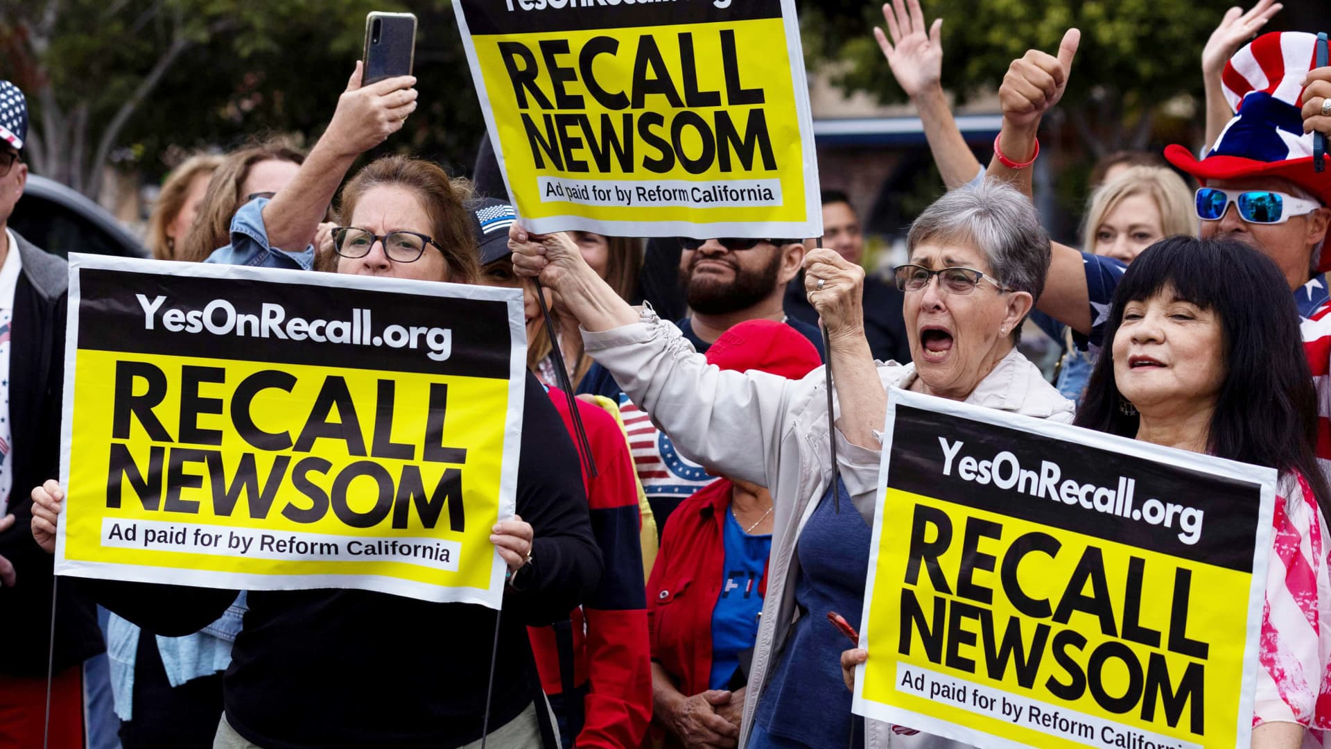 Supporters of the recall campaign of California governor Gavin Newsom prepare for the upcoming recall election with a rally and information session in Carlsbad, California, June 30, 2021.