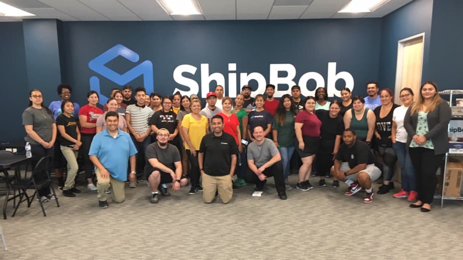 ShipBob employees with CEO Dhruv Saxena in middle