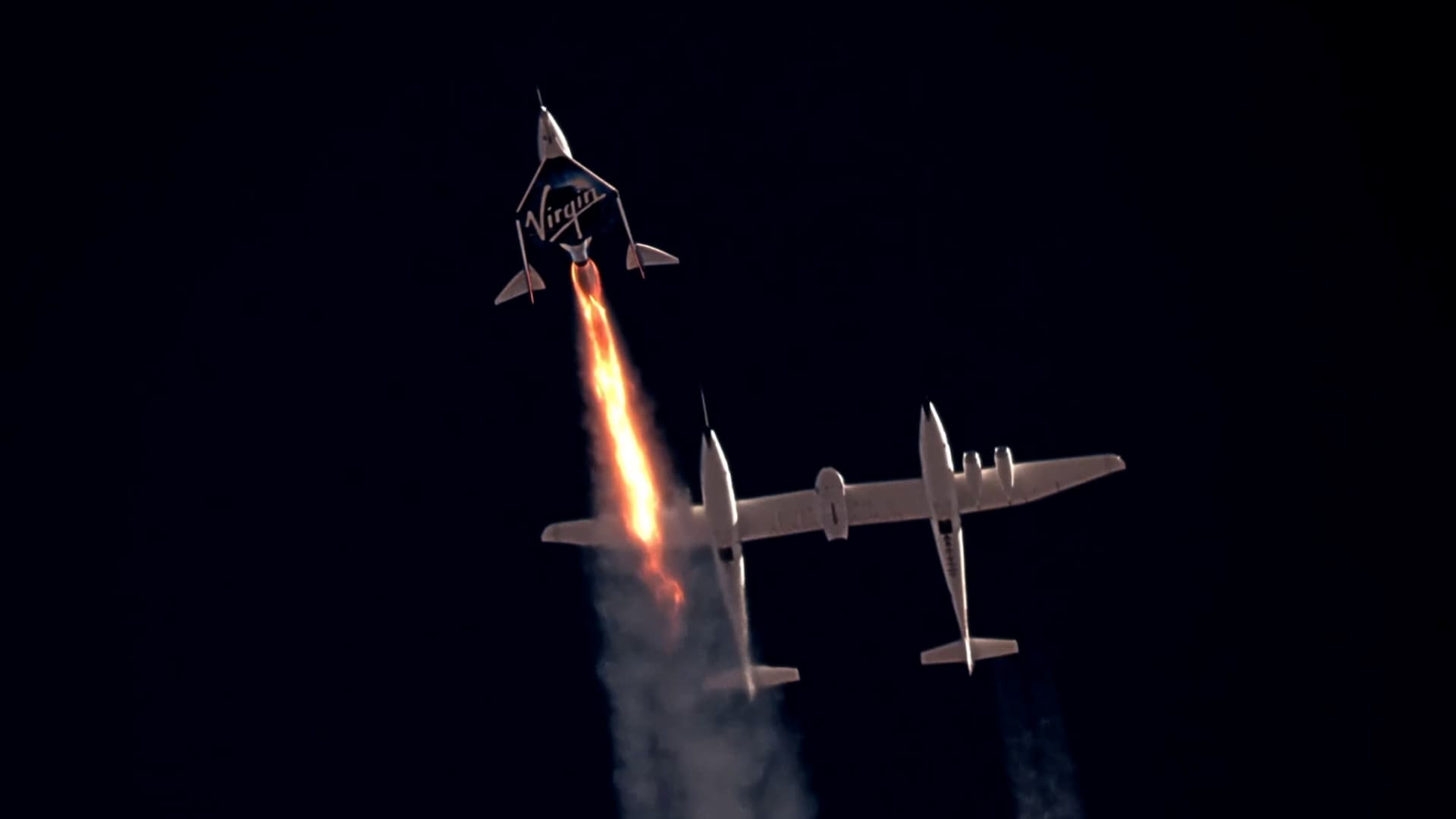 Virgin Galactic's passenger rocket plane VSS Unity, carrying Richard Branson and crew, begins its ascent to the edge of space above Spaceport America near Truth or Consequences, New Mexico, U.S. July 11, 2021 in a still image from video.