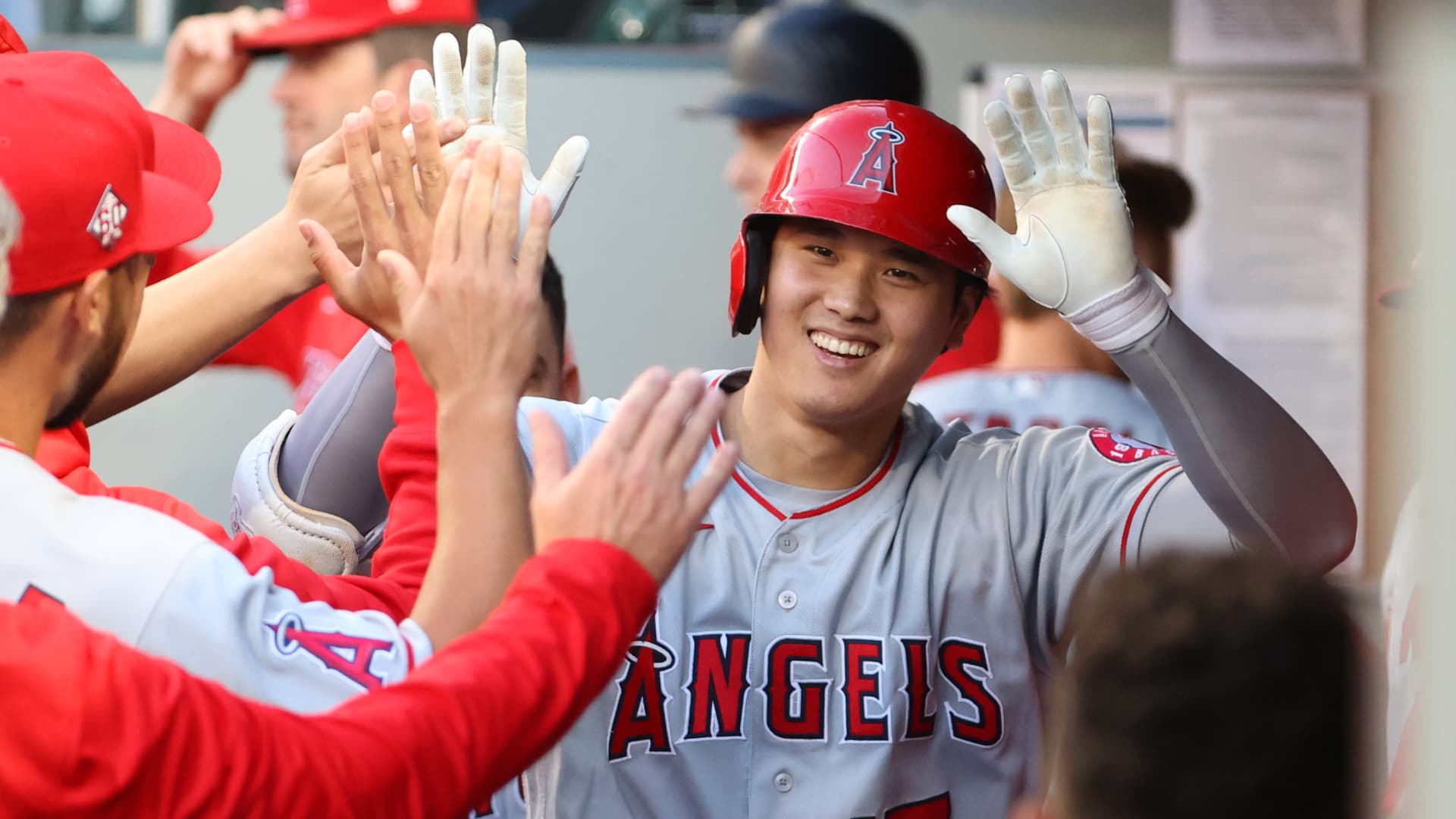 Shohei Ohtani #17 of the Los Angeles Angels celebrates in the dugout after hitting a solo home run during the third inning against the Seattle Mariners at T-Mobile Park on July 09, 2021 in Seattle, Washington.