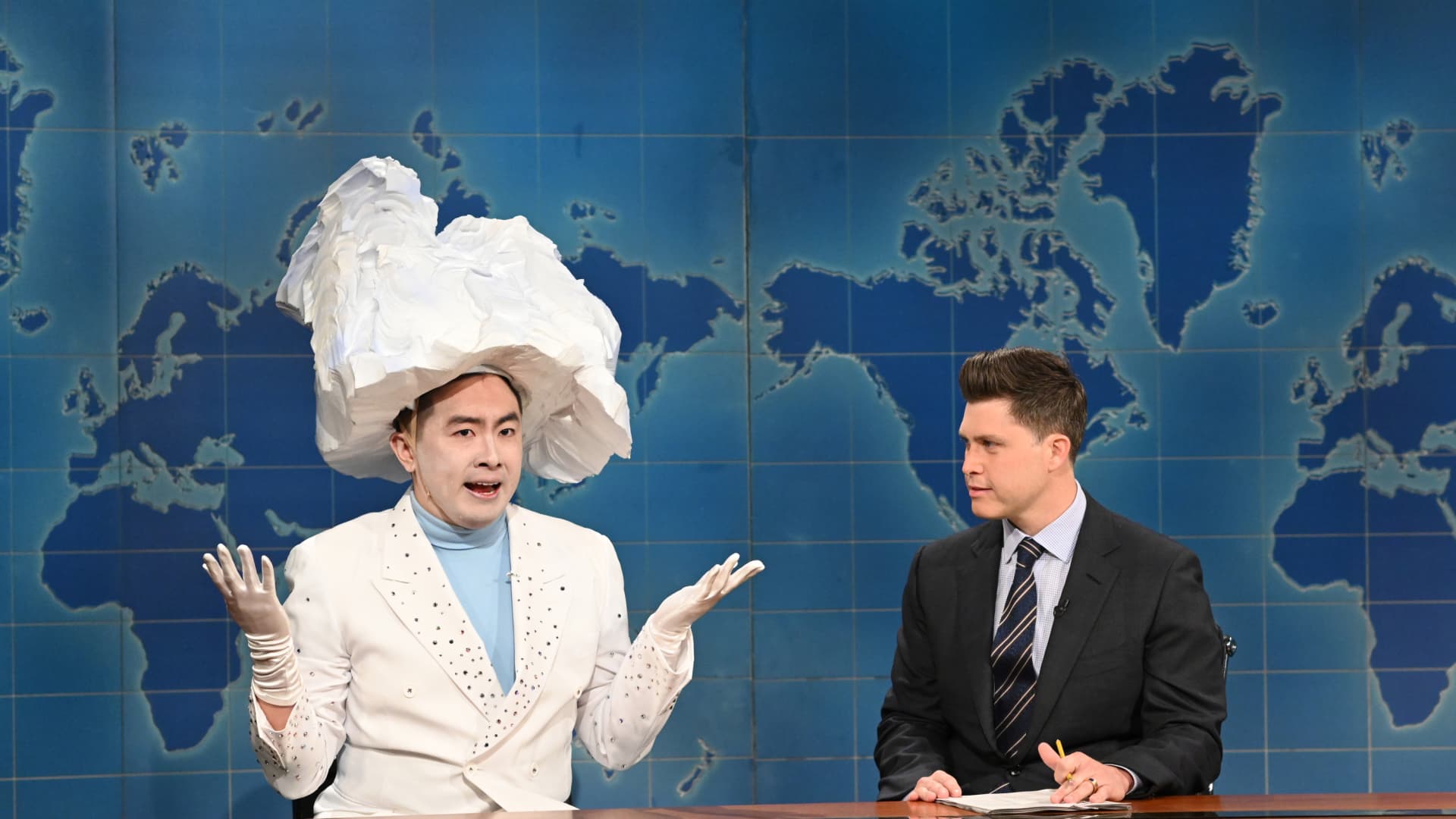 Pictured: (l-r) Bowen Yang as 'The Iceberg That Sank The Titanic' and anchor Colin Jost during Weekend Update on Saturday, April 10, 2021.