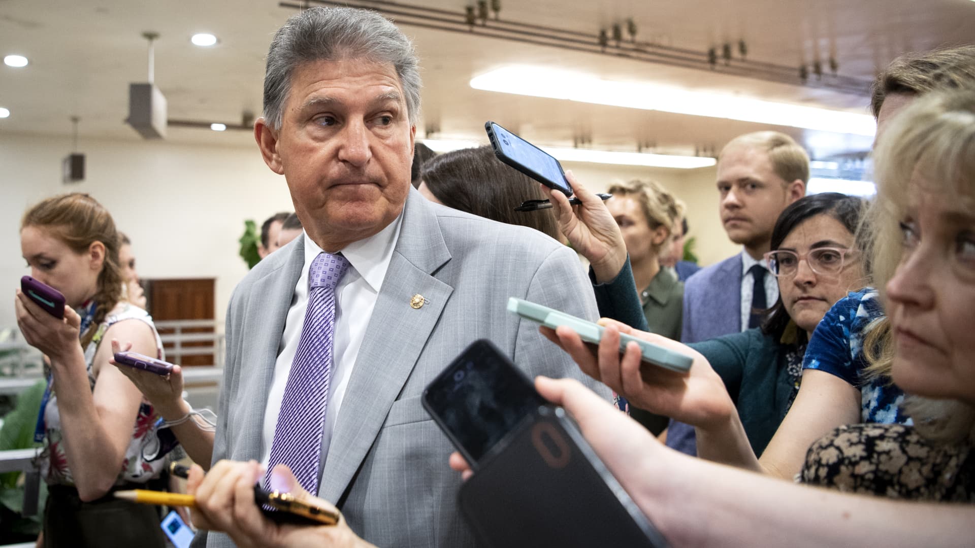 Sen. Joe Manchin, D-W. Va., talks with reporters as he makes his way to the Senate floor for a vote in Washington on Tuesday, July 13, 2021.