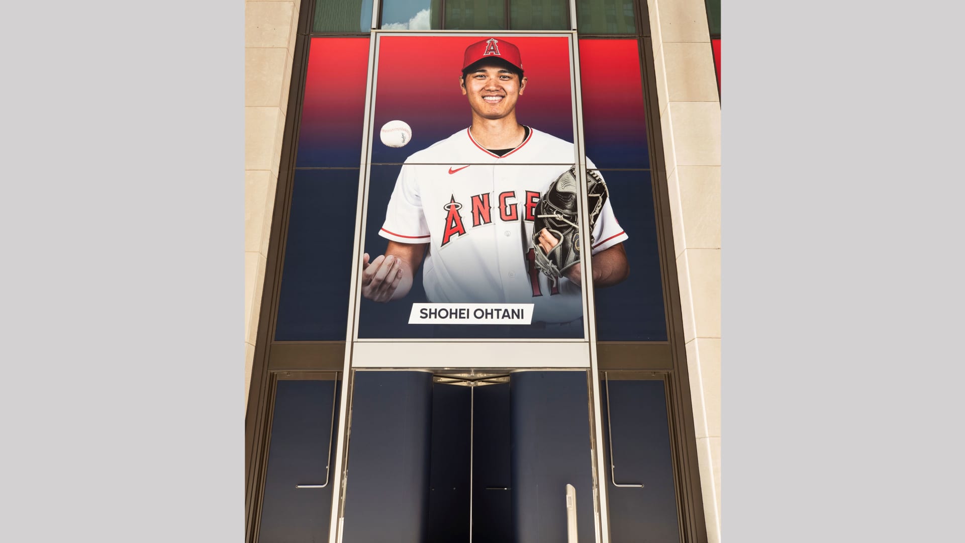 Signage featuring Shohei Ohtani is displayed outside of MLB headquarters in New York.