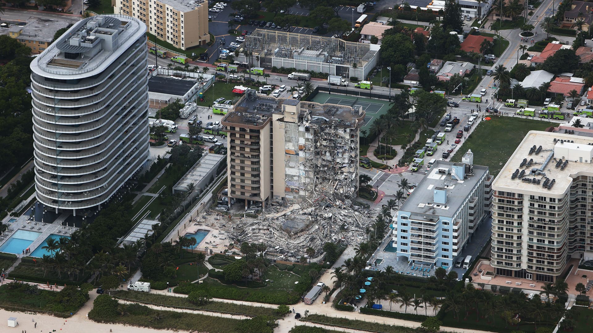 In this aerial view, search and rescue personnel work after the partial collapse of the 12-story Champlain Towers South condo building on June 24, 2021 in Surfside, Florida.