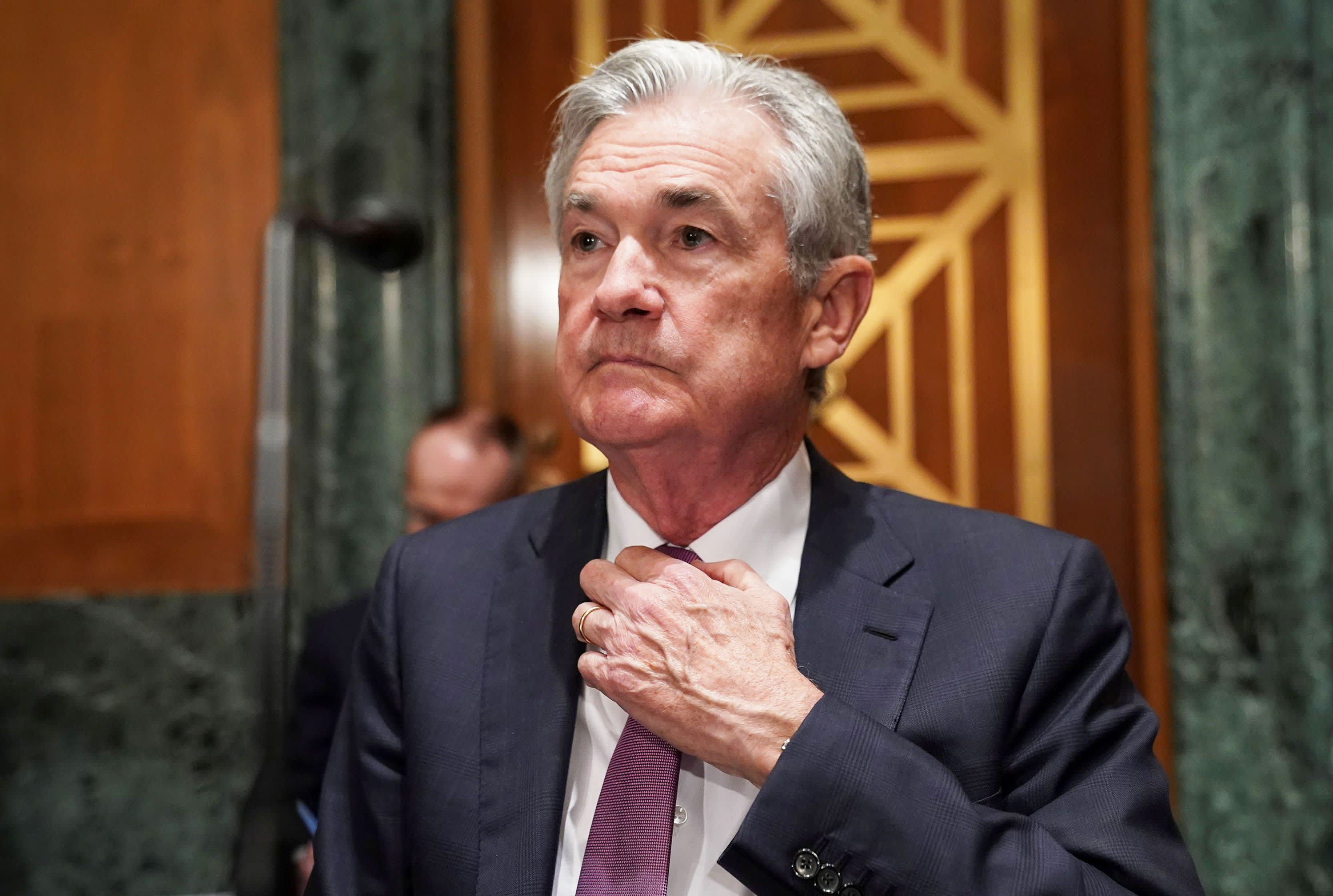 Federal Reserve holds interest rates steady, says tapering of bond buying coming..
