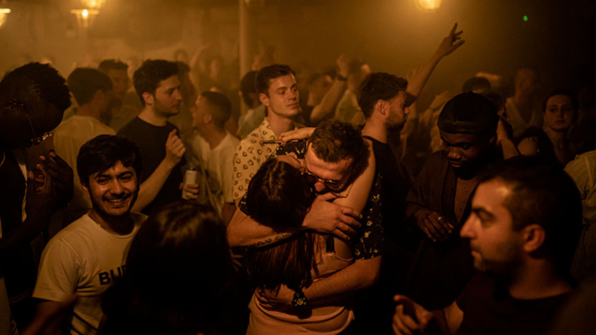 Two people hug in the middle of the dancefloor at Egg London nightclub in the early hours of July 19, 2021 in London, England. As of 12:01 on Monday, July 19, England will drop most of its remaining Covid-19 social restrictions, such as those requiring indoor mask-wearing and limits on group gatherings, among other rules.