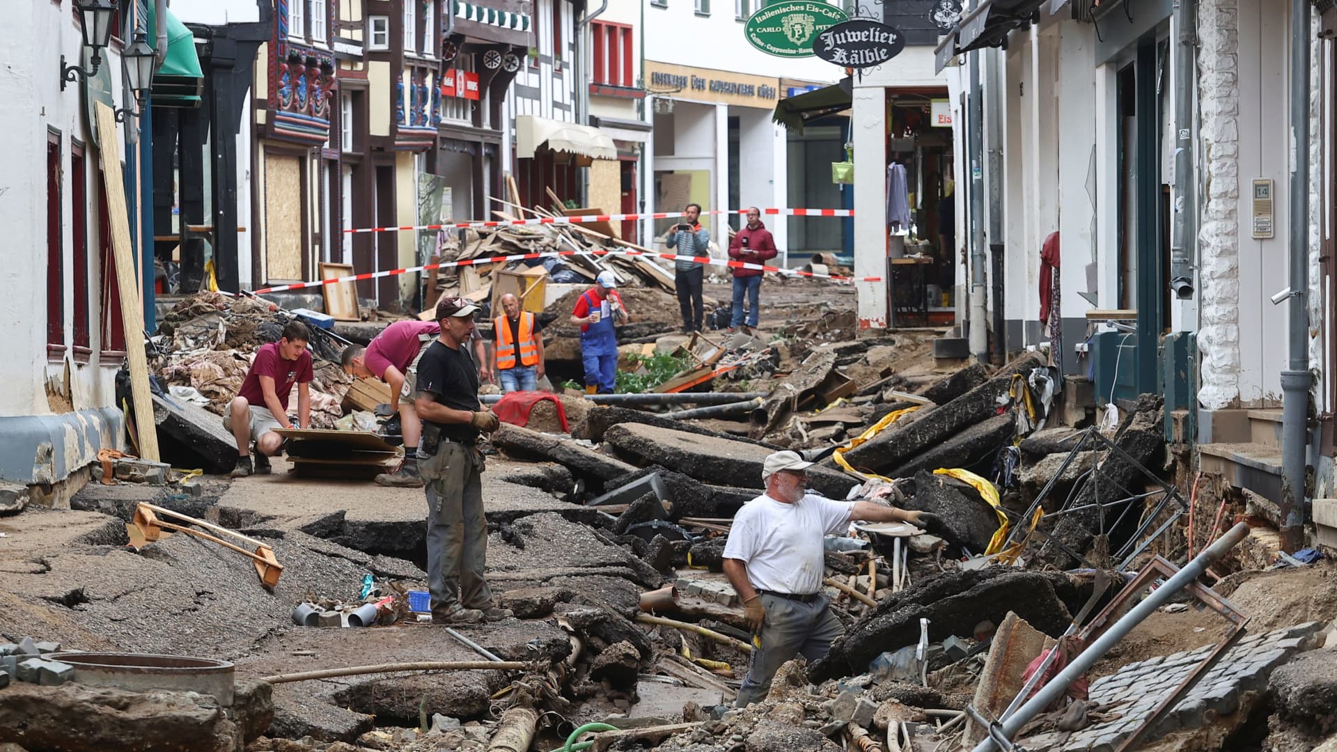 People are seen in an area affected by floods caused by heavy rainfalls in Bad Muenstereifel, Germany, July 19, 2021.