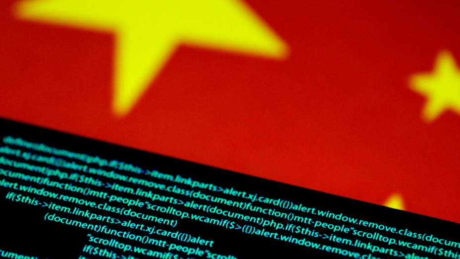 Computer code is seen on a screen above a Chinese flag in this July 12, 2017 illustration photo.