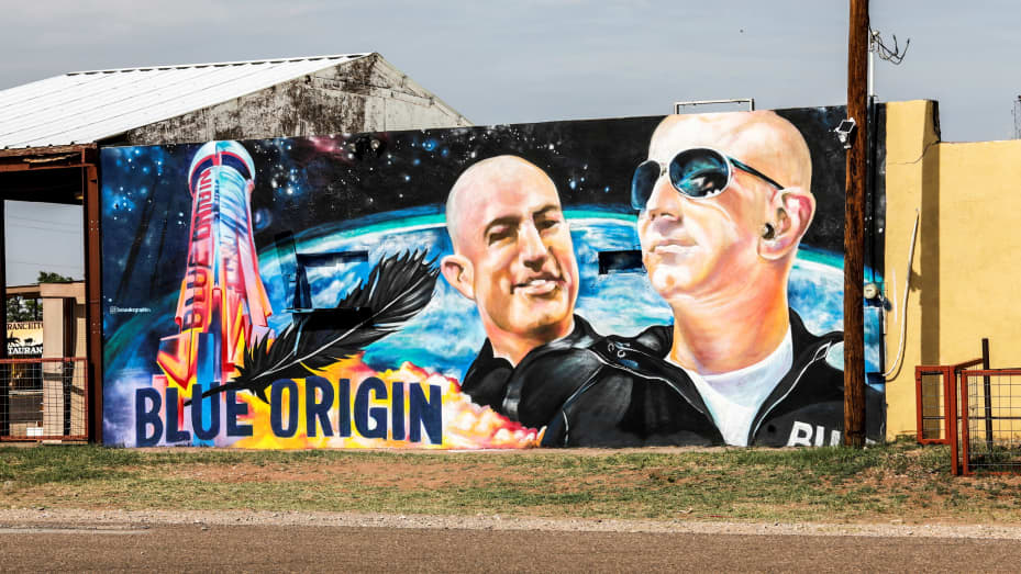 Mural displaying Jeff Bezo and his brother Mark Bezo, is seen in Van Horn, Texas, two days before the scheduled launch of Blue Origin's inaugural flight to the edge of space by billionaire American businessman Jeff Bezos and his three crewmates, in the ne