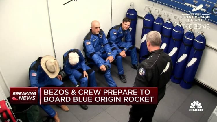 Jeff Bezos and crew prepare to board Blue Origin rocket
