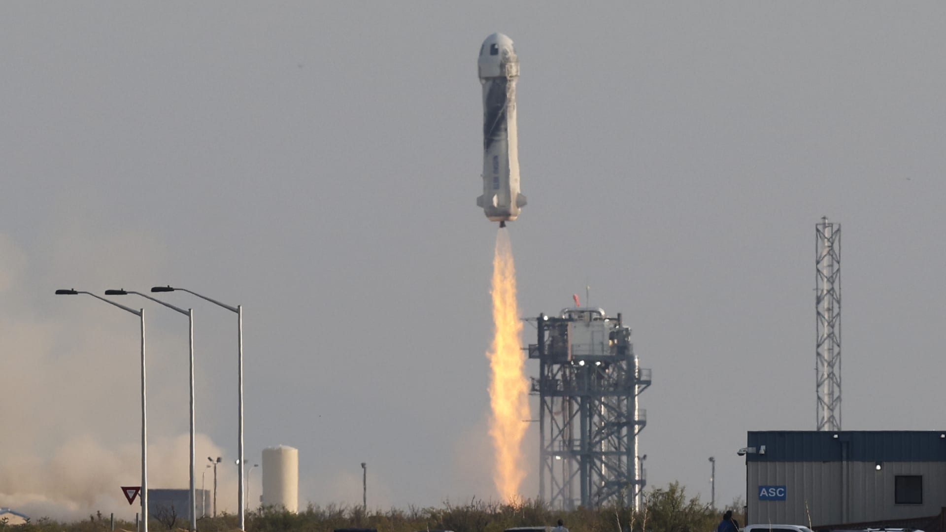 Billionaire businessman Jeff Bezos is launched with three crew members aboard a New Shepard rocket on the world's first unpiloted suborbital flight from Blue Origin's Launch Site 1 near Van Horn, Texas, July 20, 2021.