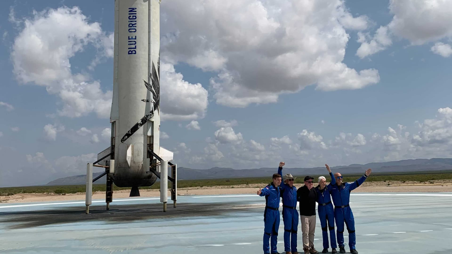 Jeff Bezos and his crew pose in front of the Blue Origin's New Shepard rocket on July 20th, 2021.