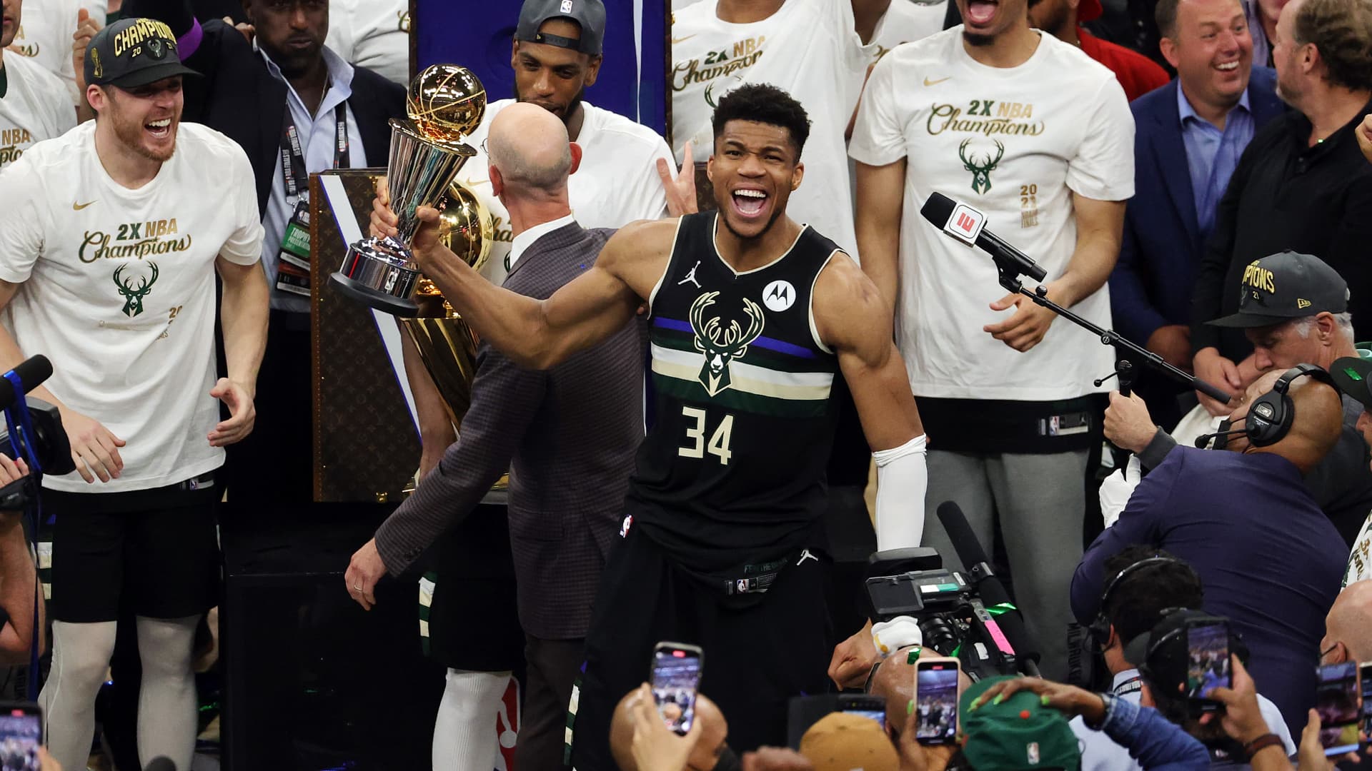 MILWAUKEE, WISCONSIN - JULY 20: Giannis Antetokounmpo #34 of the Milwaukee Bucks celebrates winning the Bill Russell NBA Finals MVP Award after defeating the Phoenix Suns in Game Six to win the 2021 NBA Finals at Fiserv Forum on July 20, 2021 in Milwaukee, Wisconsin. NOTE TO USER: User expressly acknowledges and agrees that, by downloading and or using this photograph, User is consenting to the terms and conditions of the Getty Images License Agreement.(Photo by Jonathan Daniel/Getty Images)