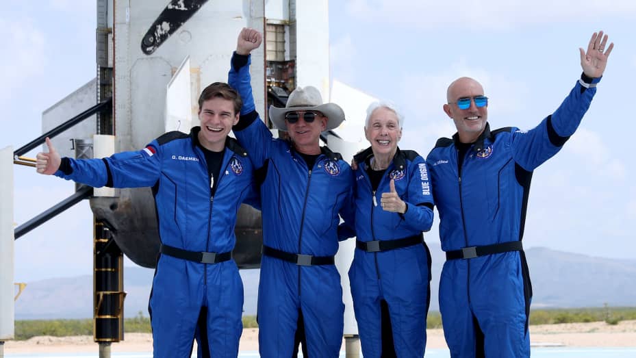 Blue Origin’s New Shepard crew (L-R) Oliver Daemen, Jeff Bezos, Wally Funk, and Mark Bezos pose for a picture near the booster after flying into space in the Blue Origin New Shepard rocket on July 20, 2021 in Van Horn, Texas. Mr. Bezos and the crew were the first human spaceflight for the company.